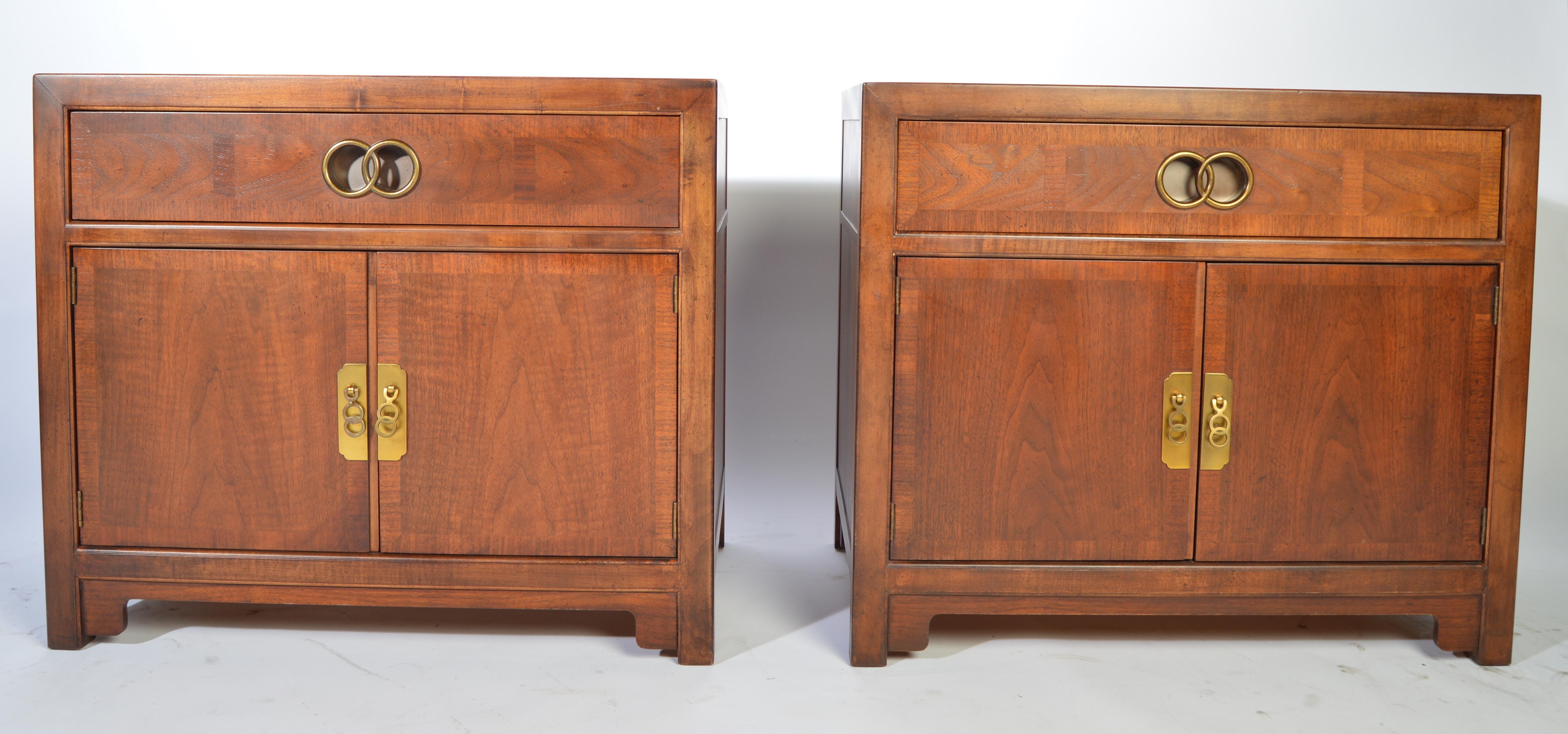 A pair of Baker nightstands designed by Michael Taylor for their Far East collection having brass pulls with signature behind each. Constructed with a blend of mahogany and walnut,
circa 1955
In outstanding condition throughout. Masterfully