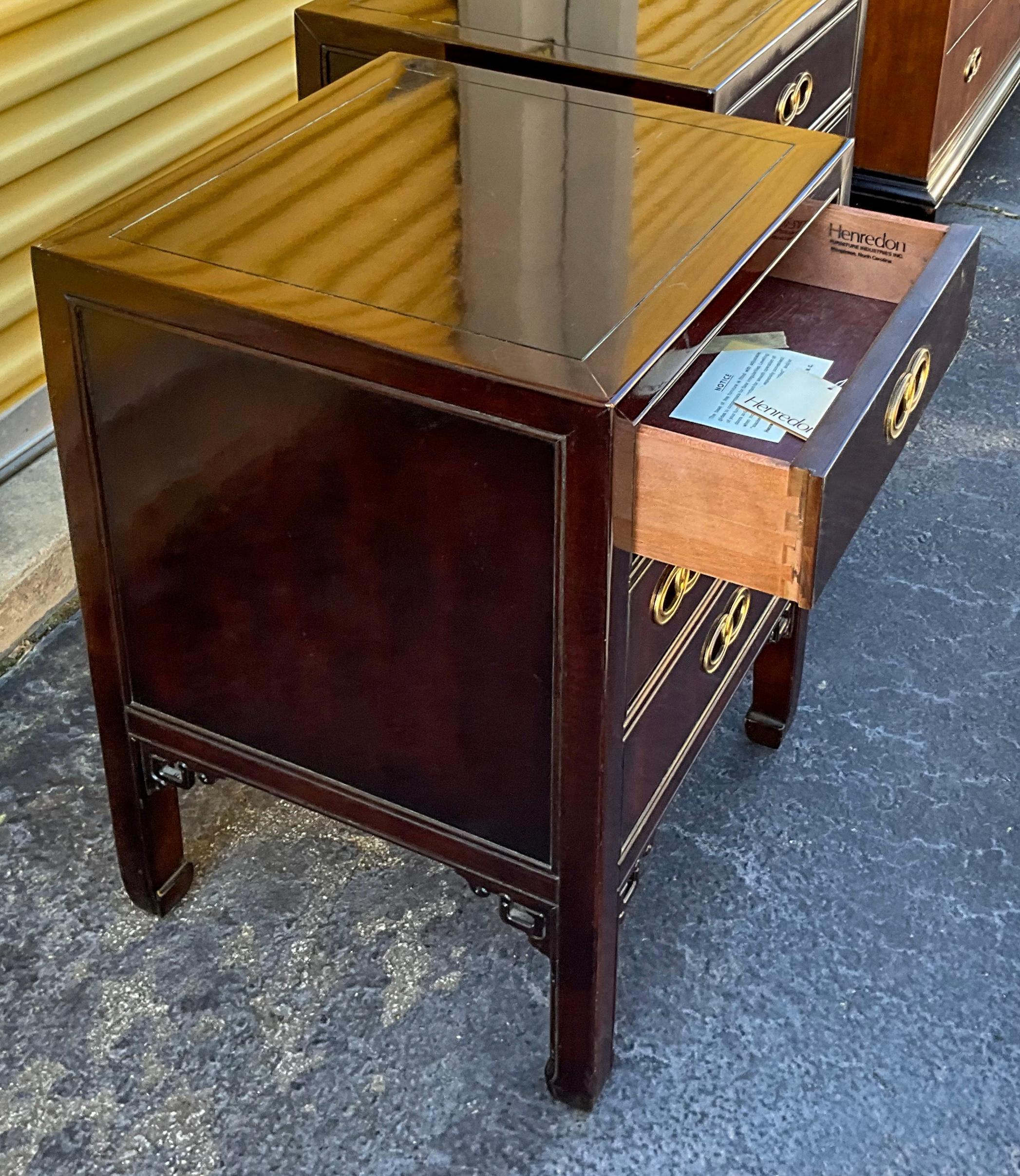 This is a handsome pair of mahogany side tables designed by Michael Taylor for Henredon. They are in very good condition and are marked.