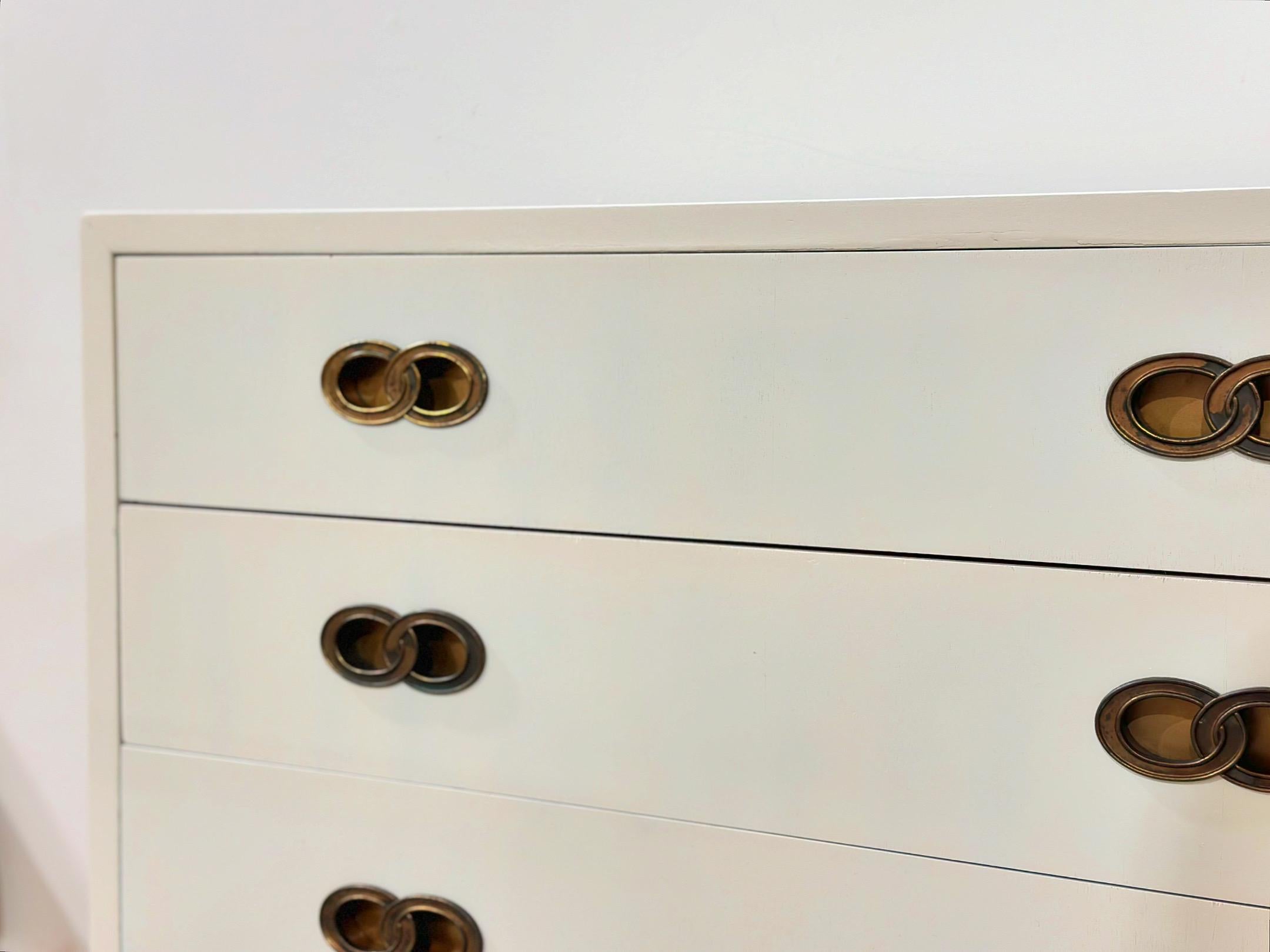 Vintage 8 drawer chest from Michael Taylor for Henredon, circa 1975. Stout, expertly crafted hardwood case finished in an off white cream lacquer. Inset elegant solid brass hardware. Modern, organic and memorable. Fully restored by our team and in