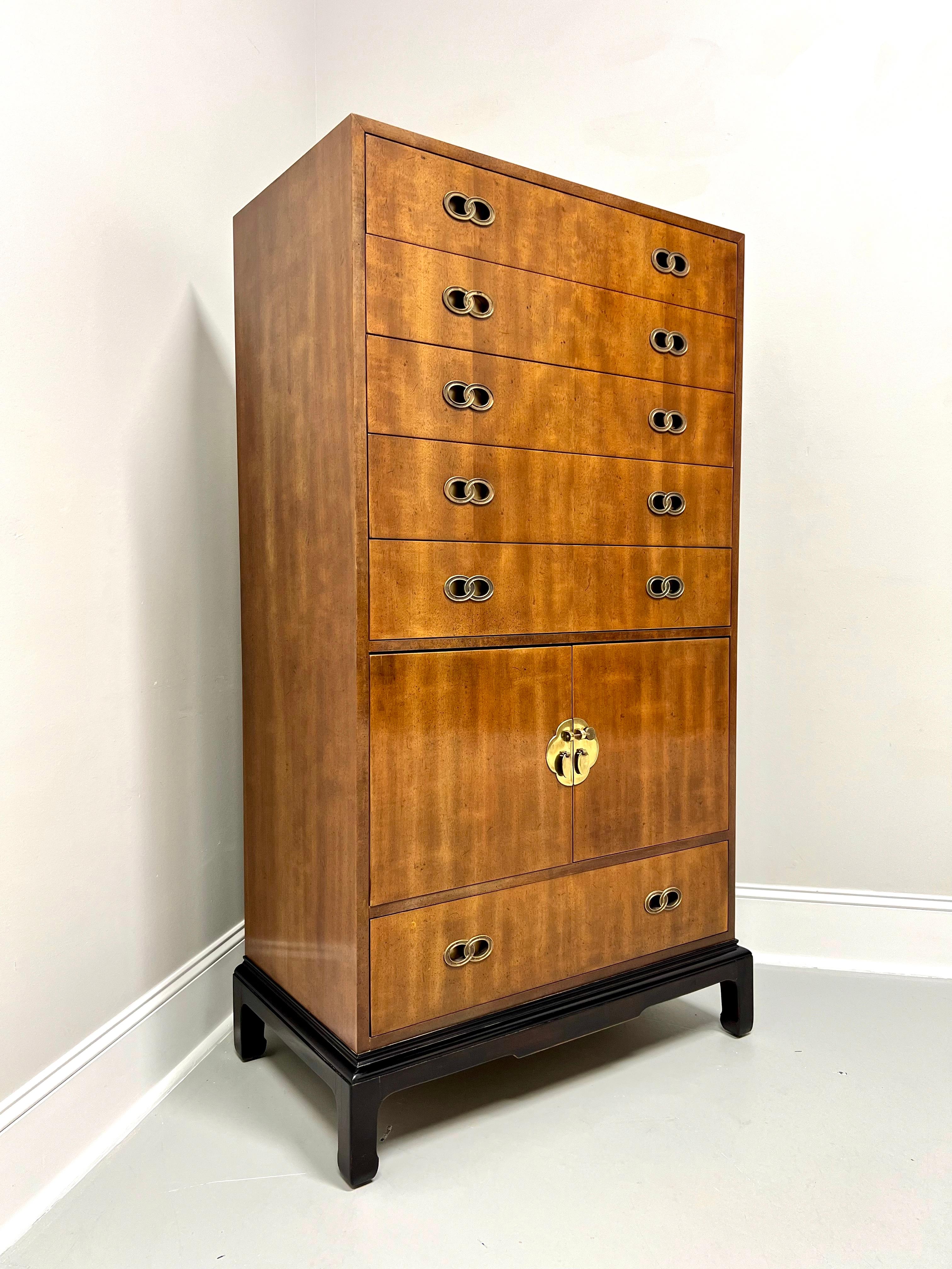 An Asian inspired chest of drawers designed by Michael Taylor for Henredon. Mahogany with a slightly distressed finish, decorative brass hardware, square edge to top, Ming design black lacquered base with curved inward square legs. Features five