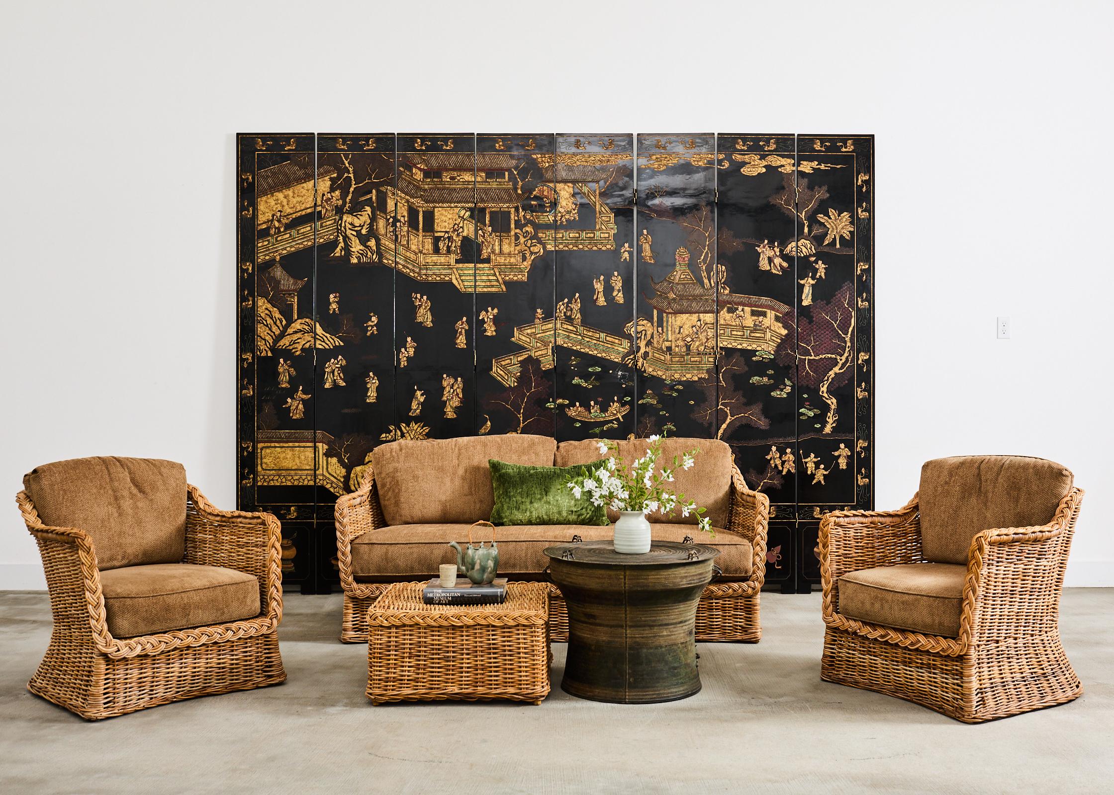 Grand five-piece living room suite of rattan and wicker made in the California  coastal manner and style of Michael Taylor. Midcentury furnishings manufactured by Y.M. Jack and Co. in Sydney, Australia. The wicker set consists of a sofa settee, a