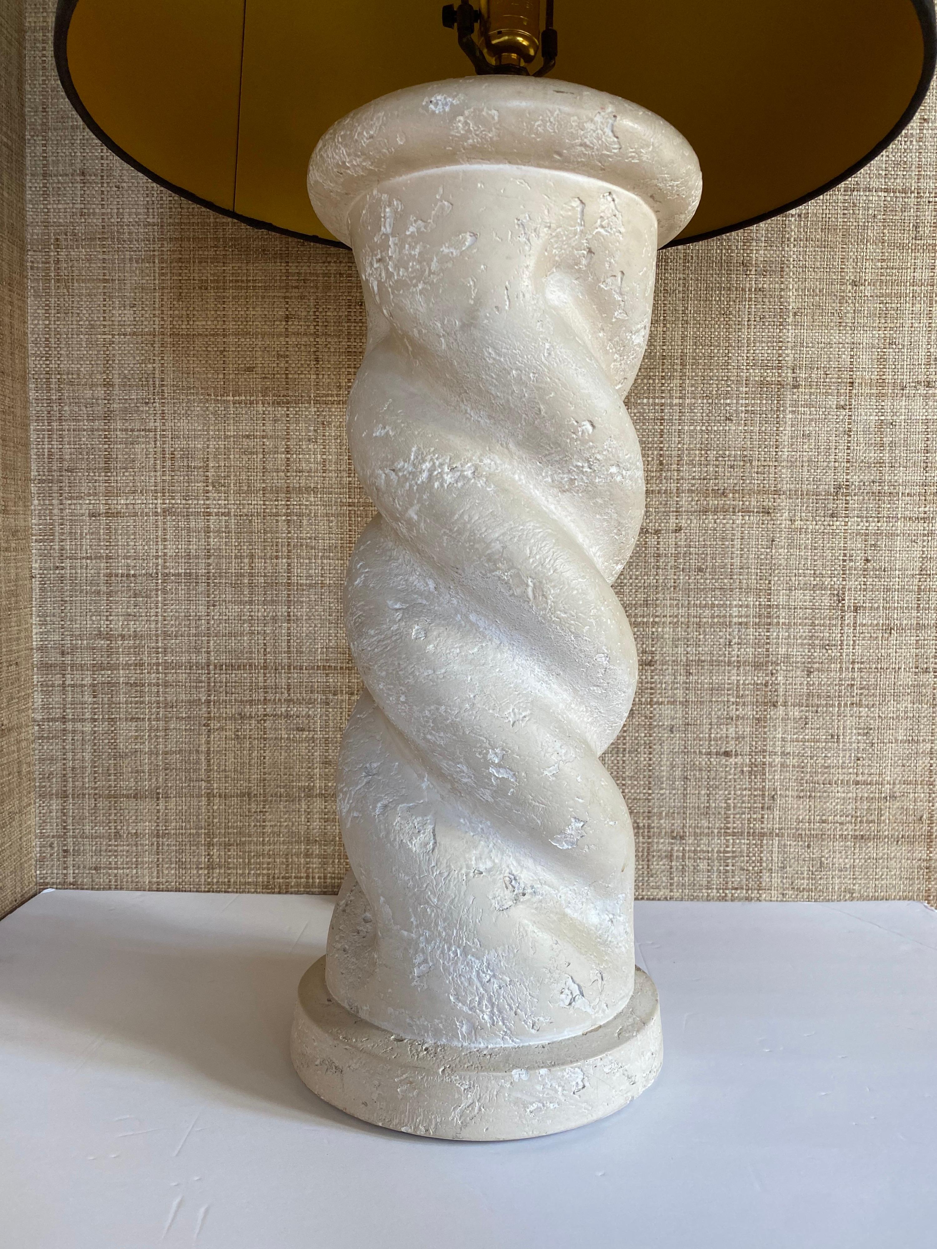 Chunky and substantial Michael Taylor style twisted spiral table lamp, circa 1980's. This architectural column form lamp features a textural warm matte white/cream plaster finish. Lamp shade not included.

Measures: Height to finial: 32 inches.