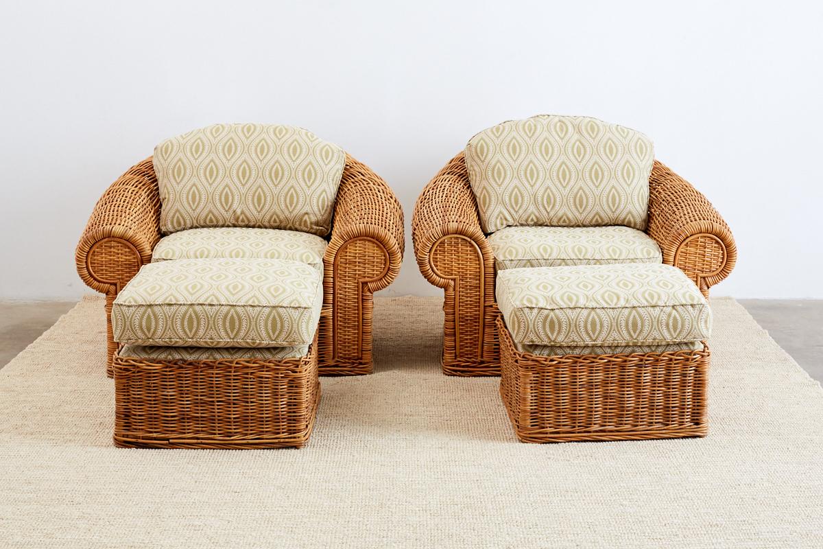 Pair of grand wicker lounge chairs and ottomans inspired by Michael Taylor. Made by Wicker Works in San Francisco, CA. These patio chairs feature a large hardwood frame with a sculptural design known as the Tonda model. Topped with deep seat