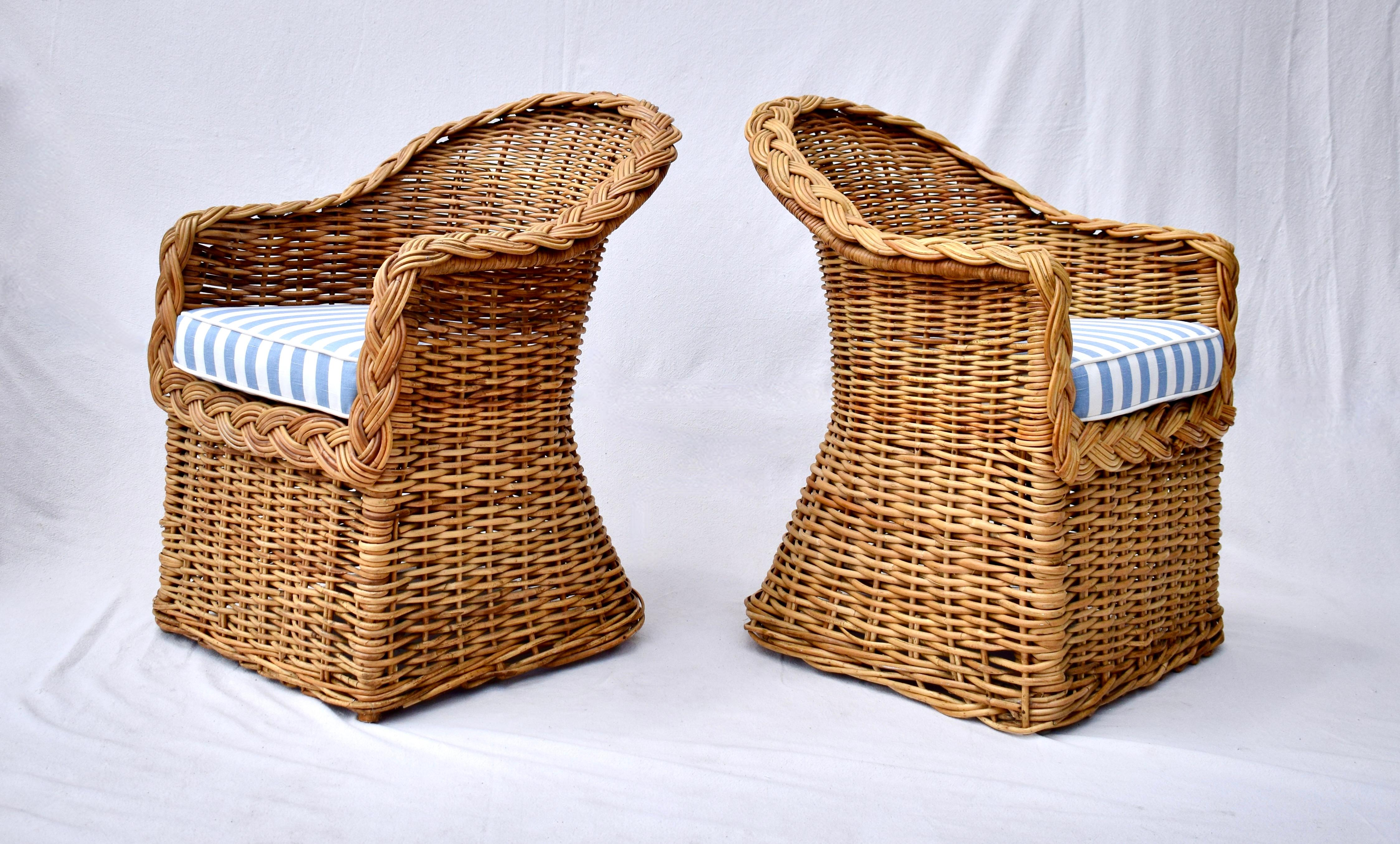 A pair of Michael Taylor hand crafted braided wicker rattan armchairs with new custom loose seat cushions upholstered in vintage new stock Ralph Lauren sky blue and white cotton linen. Marvelous mid size scale; Seats: 19
