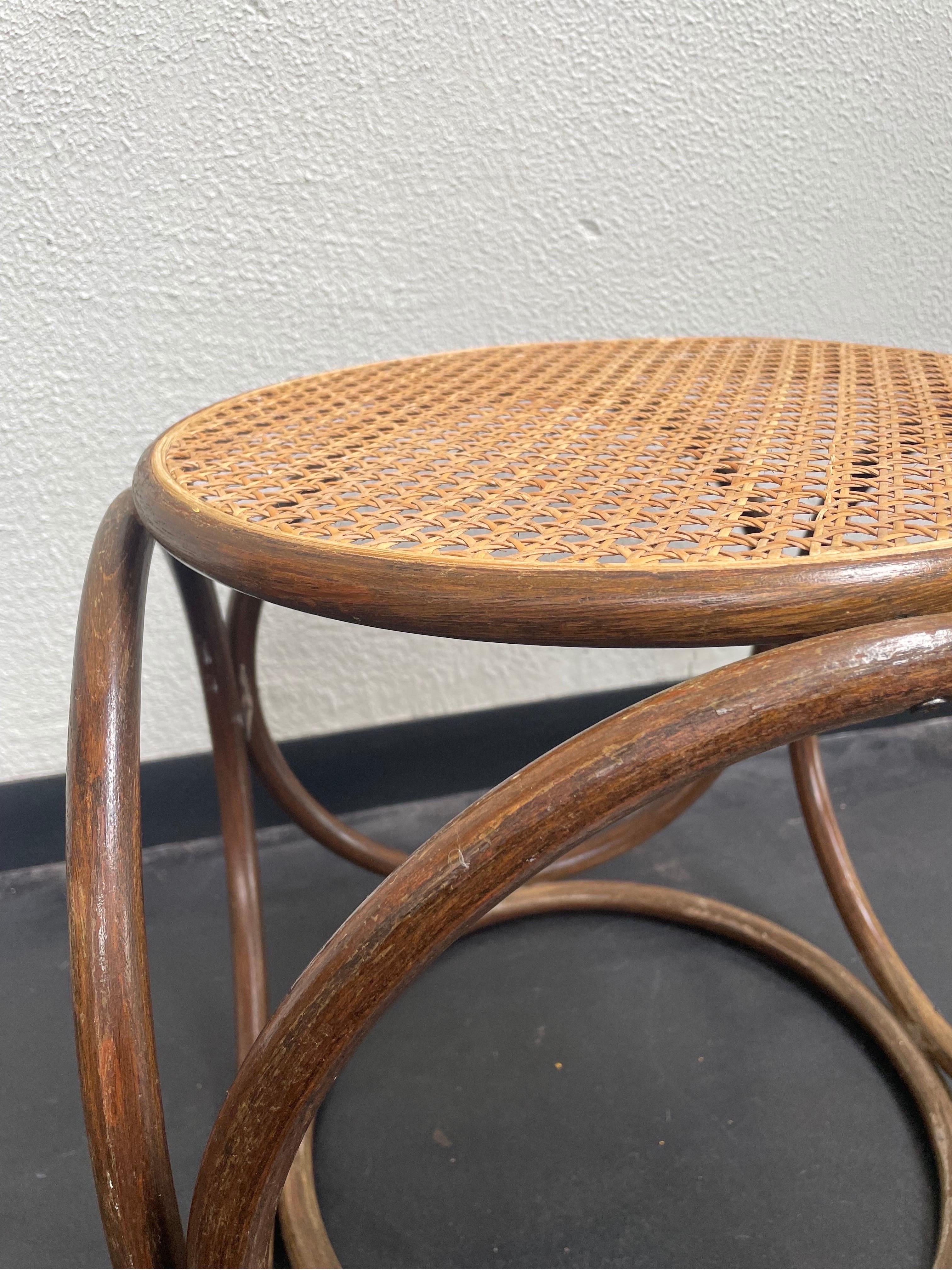 Vintage Michael Thonet footstool/side table with bentwood and cane features.