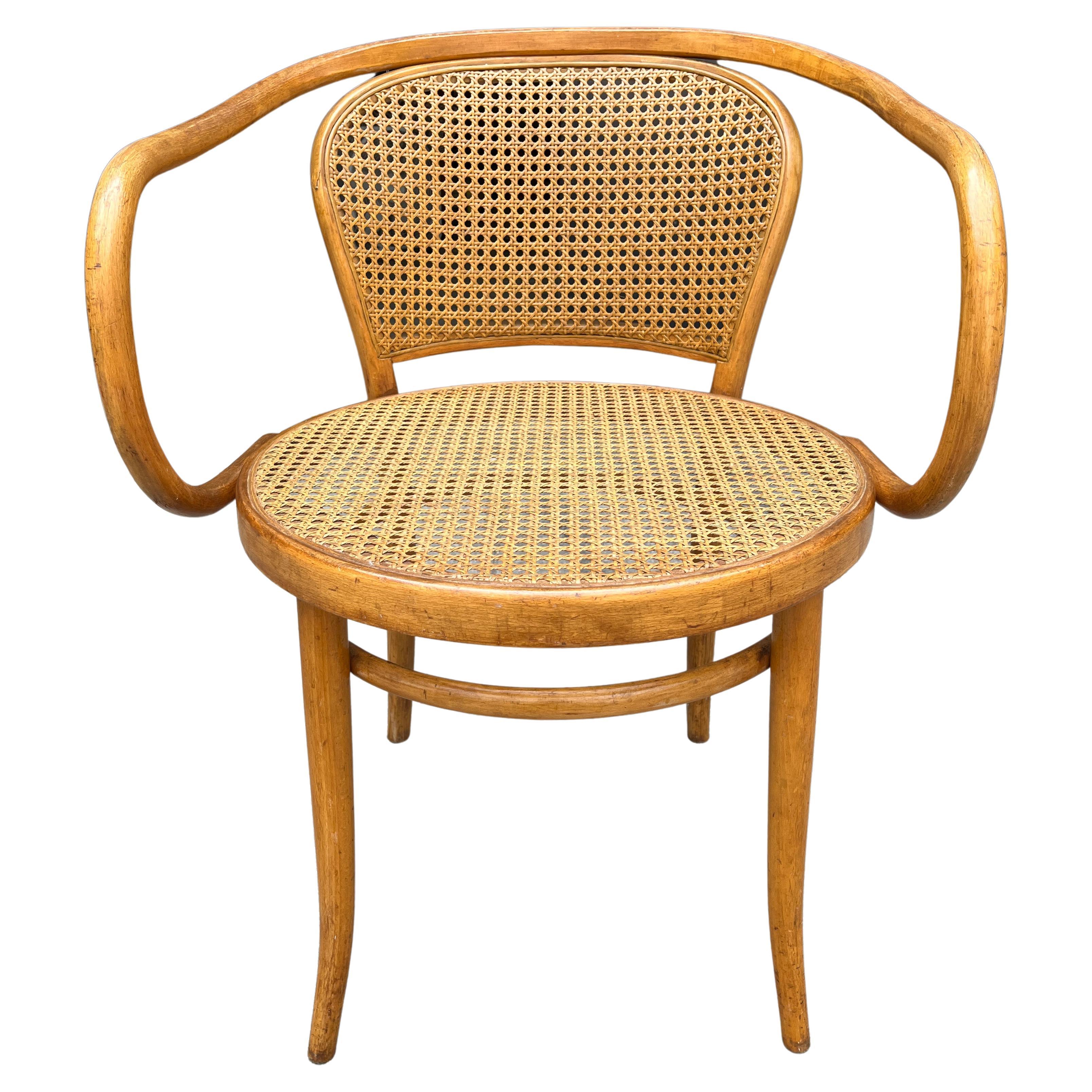 Chair nr 210 designed by Gebrüder Thonet in 1900, (as well as nr 209) of renown designer Le Corbusier. 
This chair is made in Czechoslovakia  (pre WW2 factory of Thonet).

New cane color matched 
arm height 27.5''