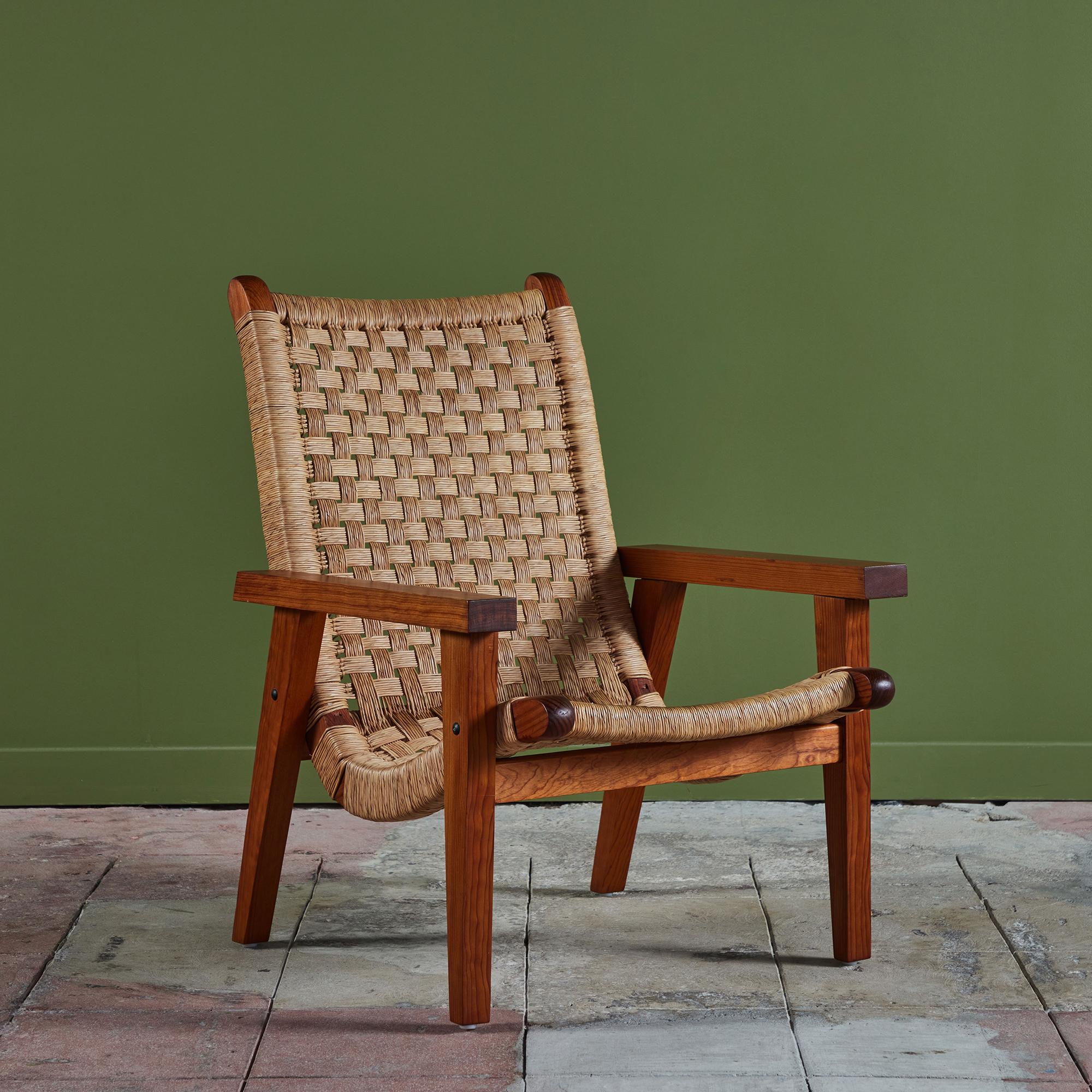 Bauhaus trained, Mexico City based designer Michael Van Beuren created highly functional modern pieces inspired by Mexican vernacular styles and materials. This lounge chair features a mahogany frame and a woven palm corded seat and