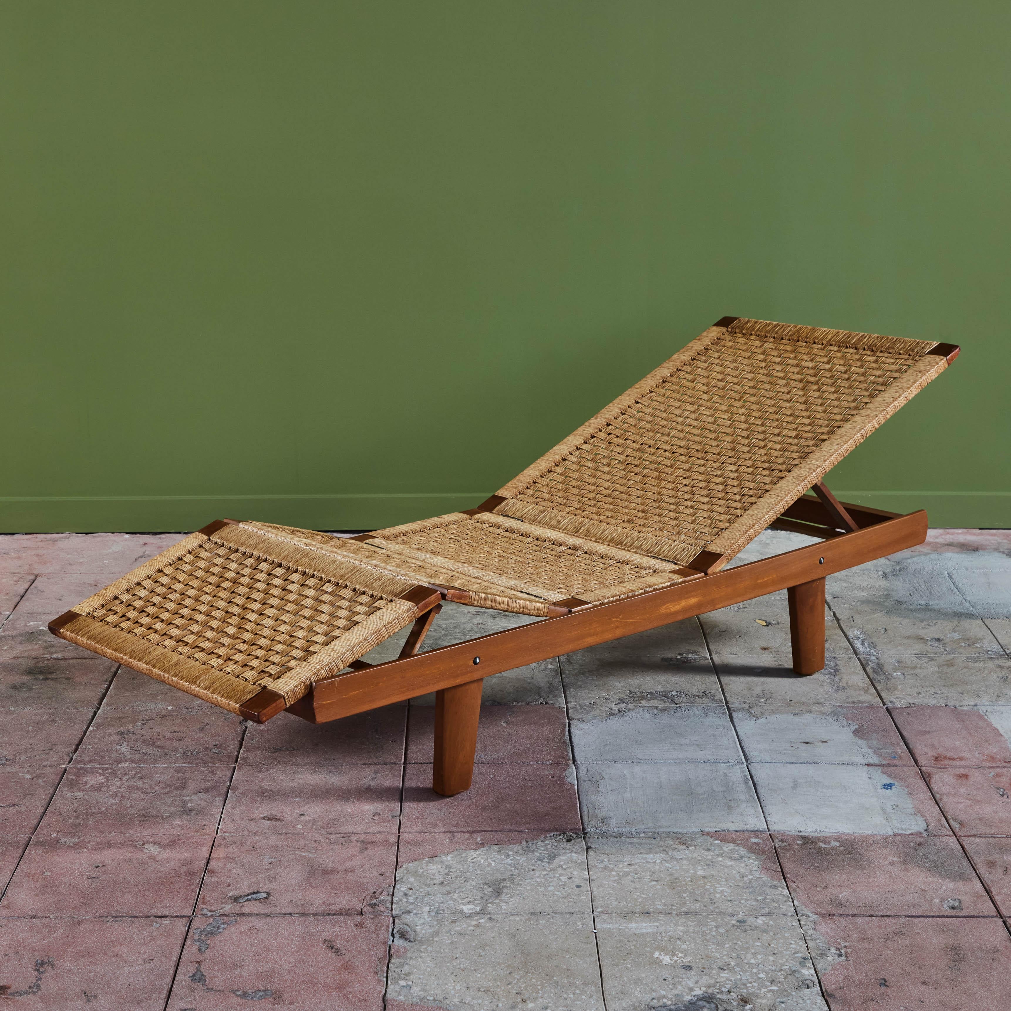 Bauhaus trained, Mexico City based designer, Michael Van Beuren created highly functional modern pieces inspired by Mexican vernacular styles and materials. This example, c.1950s Mexico has a pine frame with a woven rattan seat. The piece lays flat