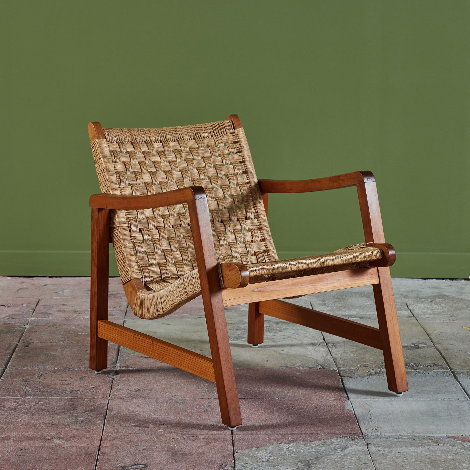 Bauhaus trained, Mexico City based designer Michael Van Beuren created highly functional modern pieces inspired by Mexican vernacular styles and materials. This lounge chair features a mahogany frame and a woven palm corded seat and