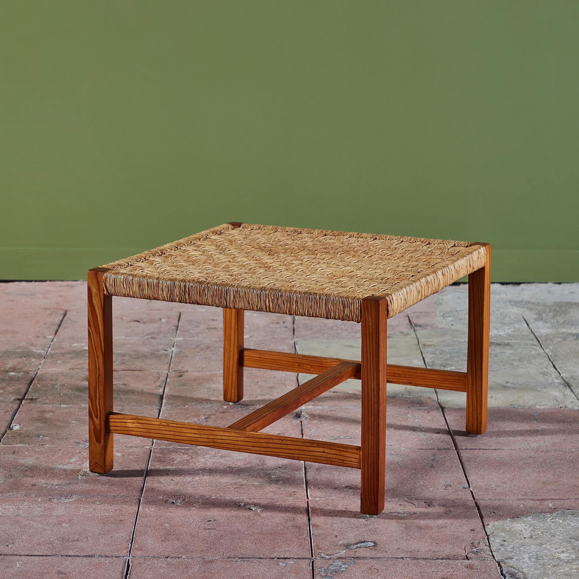 Bauhaus trained, Mexico City based desiger, Michael Van Beuren created highly functional modern pieces inspired by Mexican vernacular styles and materials. This example, c.1950s, Mexico has a pine frame with a woven rattan table top resembling a