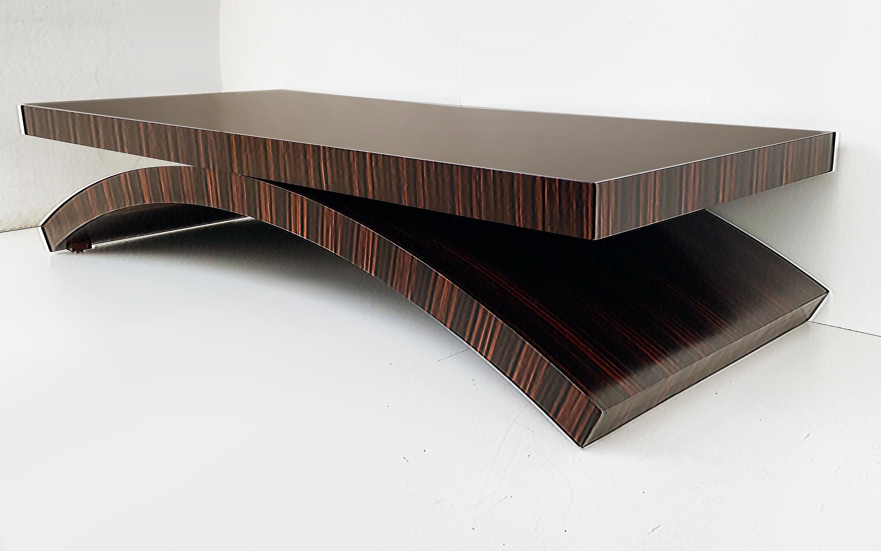 Michael Vanderbyl Boiler Macassar Ebony Arch Coffee Table, Large 

Offered for sale is a sleek contemporary coffee table designed by Michael Vanderbyl for Boiler Domicile. This Arch table is the overscaled large version that blends rich aesthetic