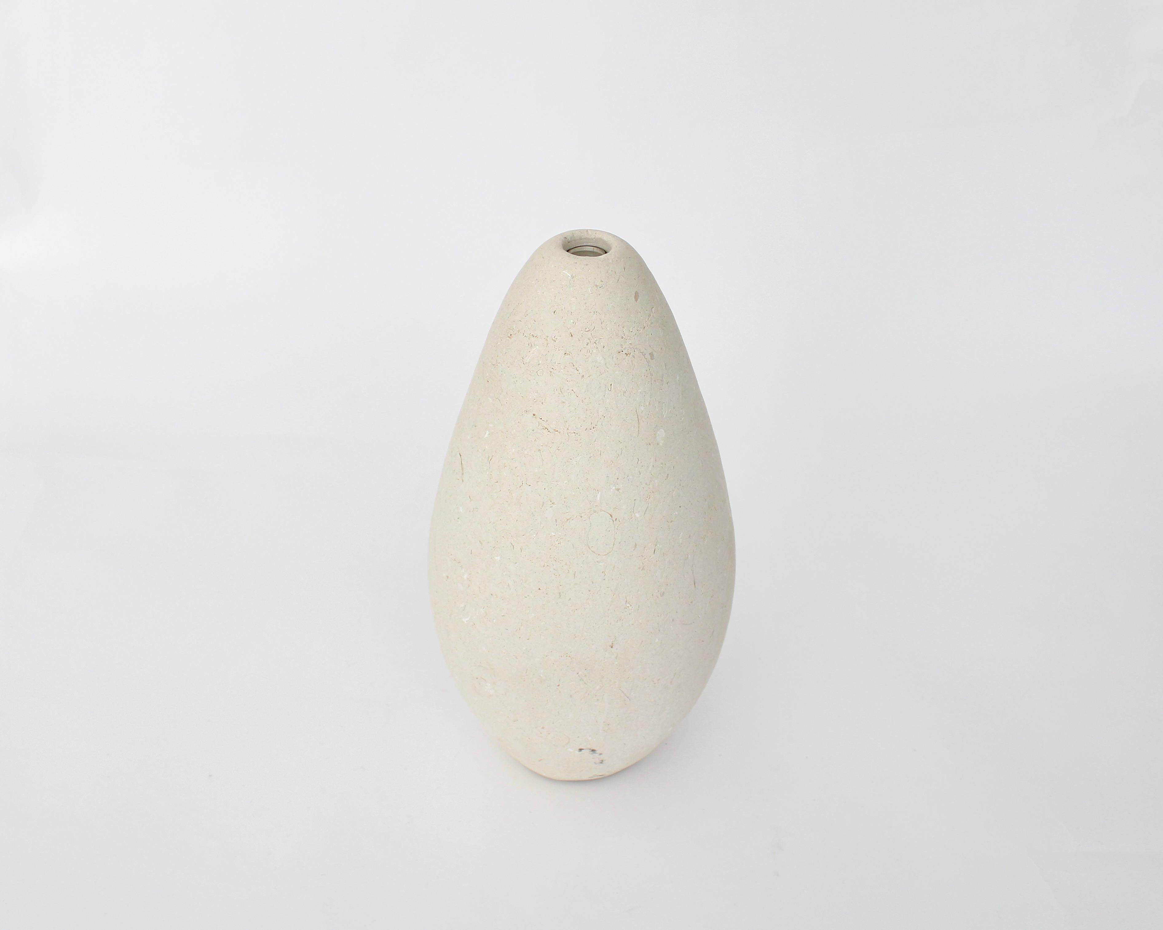 Mandorla Solifleur or single flower vase designed by Michael Verheyden is crafted in Pietra di Vicenza stone to form an organic shape and is beautiful as a vase or as sculpture. 
Belgian Designer Michael Verheyden creates uncommon objects for