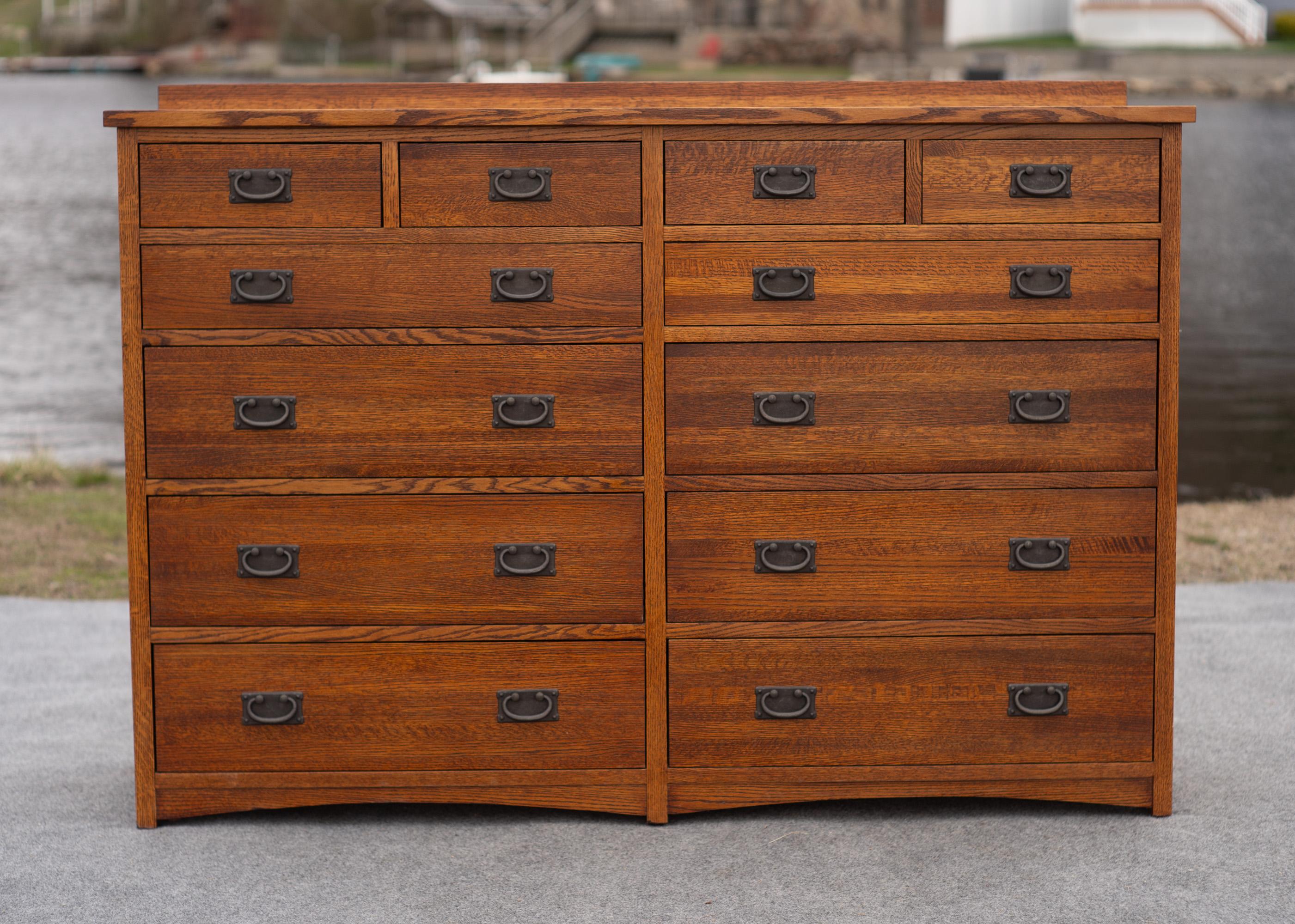 Designed by Restoration Hardware designer Michael Vermillion, this mission style cabinet evokes a classical feel with modern construction. Made primarily of a beautiful warmly finished solid golden oak exterior, it features a very high-quality