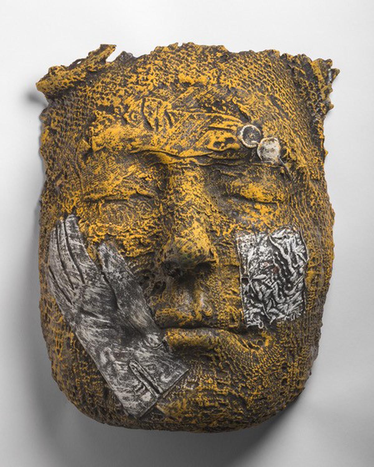 Annika with Glove by Michael Warrick
21x14x10" aluminum, wall mounted sculpture
Fragment of a portrait with impressions of their interests highlighted across the face.

Shipping price includes the custom packing necessary for safe transport of fine