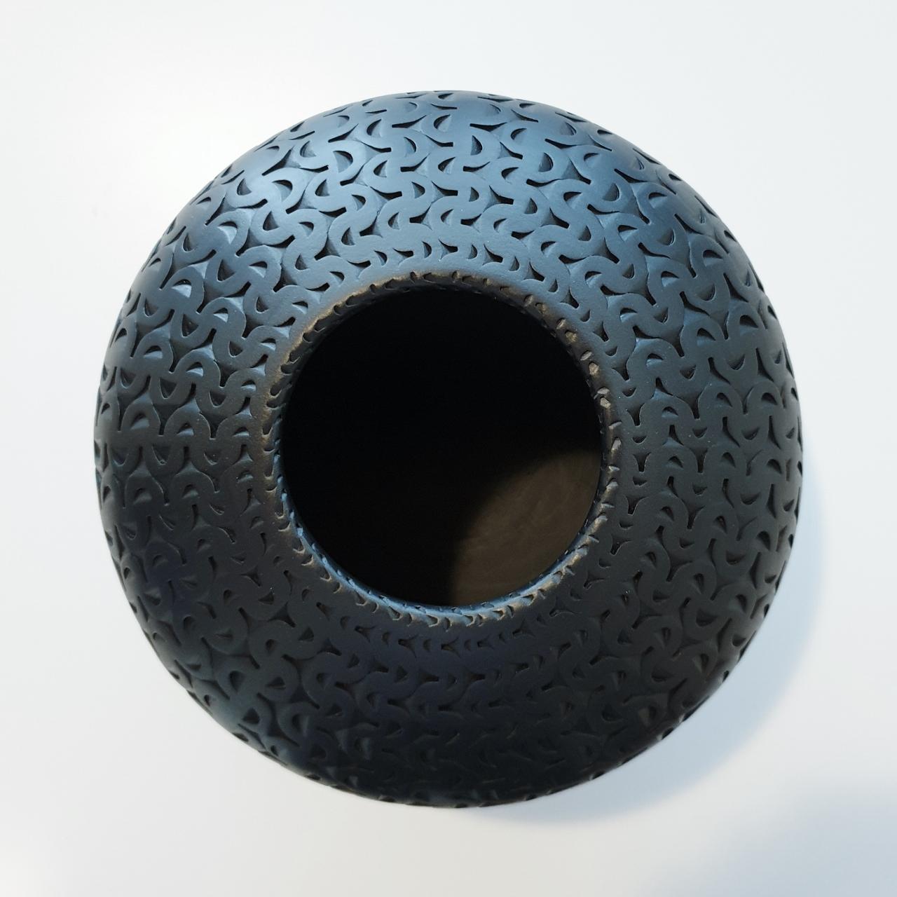 This Black Buckle Vessel is a unique medium size contemporary modern ceramic vase shaped vessel by US-artist Michael Wisner. The hand-coiled shape of this object is simple but very elegant, complementing the intense patterning made through a very