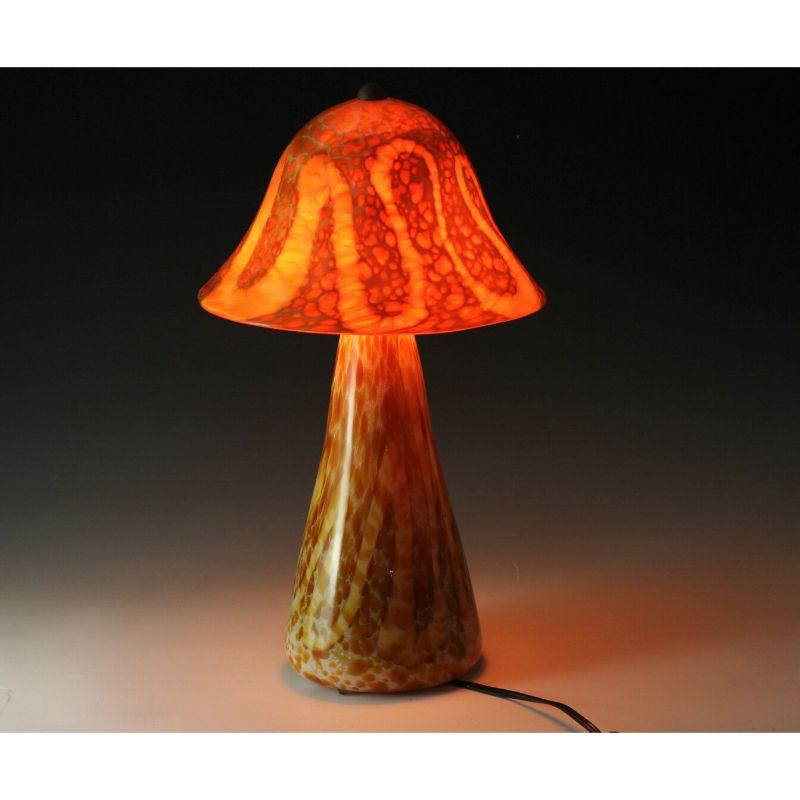 Michael Worcester 2pc Contemporary Handcrafted Art glass table lamp with Shade

Mushroom Shaped Encased Glass with Mottled Orange and Swirled Details - Signed

Additional Information:
Brand: Michael Worcester 
Type: