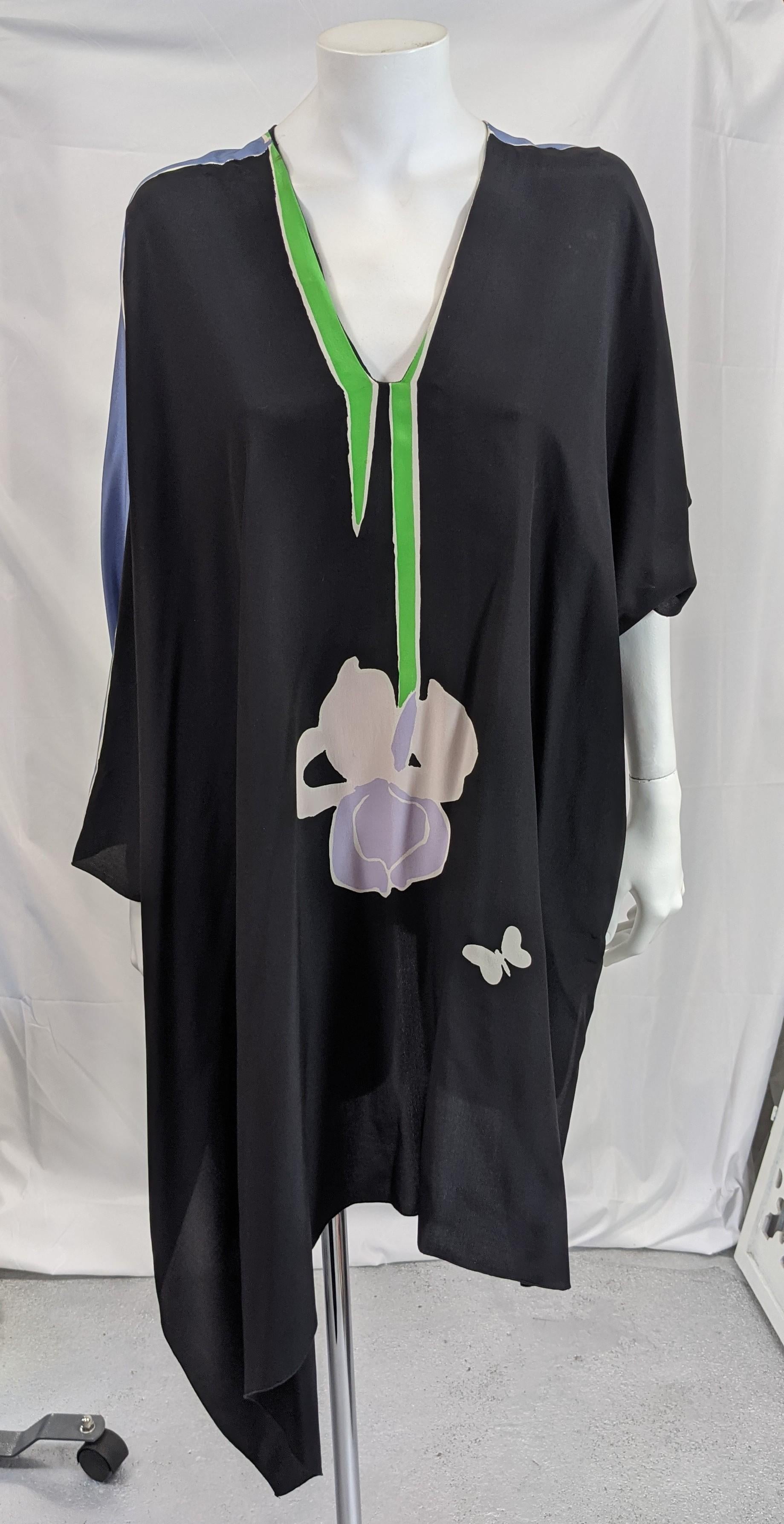 Michaele Vollbrach dramatic asymmetric silk crepe scarf point top with artist's own print. V neck styling with same flower print of M.V's original orchid design rendered in black on front and periwinkle silk on back. 
Essentially a scarf poncho