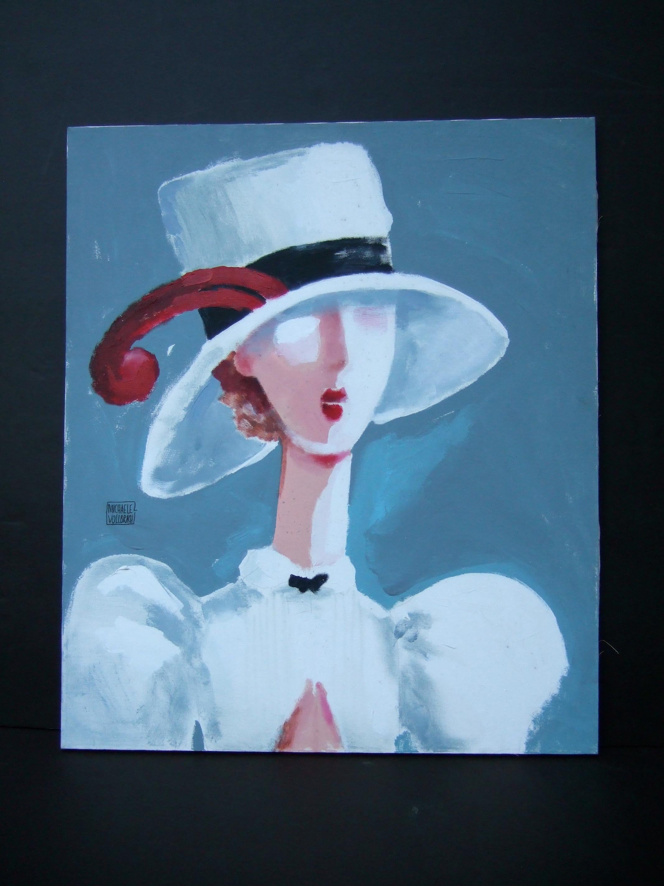 Michaele Vollbracht Rare elegant stylized woman oil painting c 1980s w 30 x 35.75 h 
The bold painting is illuminated with a chic woman in a dramatic hat
Her crisp white attire is set against a muted gray-blue background 

Vollbracht's talents and