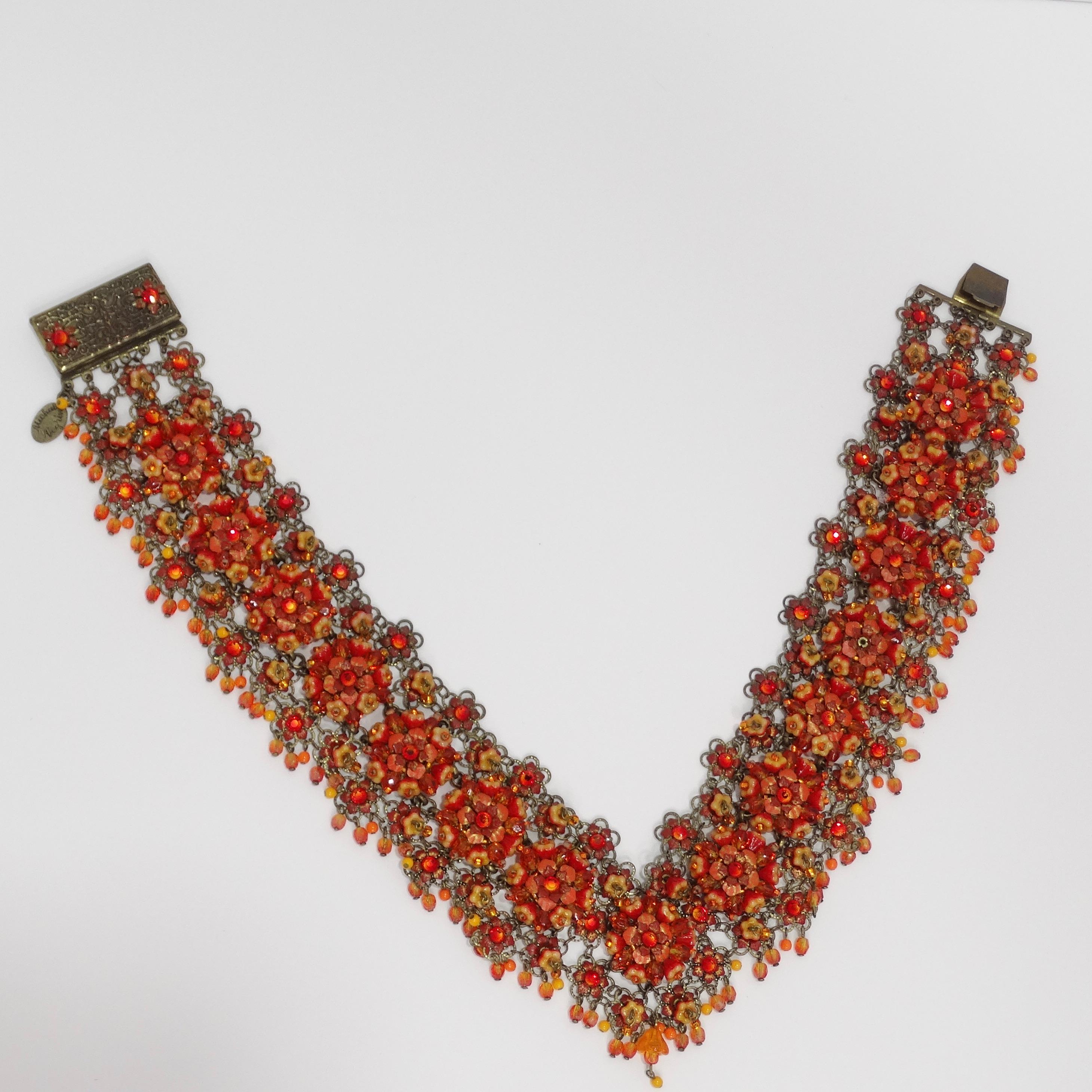 Embrace timeless beauty with the Vintage Michal Nehru Red and Orange Flower Chocker Necklace! Elevate your style with this exquisite vintage piece from Michal Negrin, a renowned name in jewelry craftsmanship. This stunning chocker necklace sits on