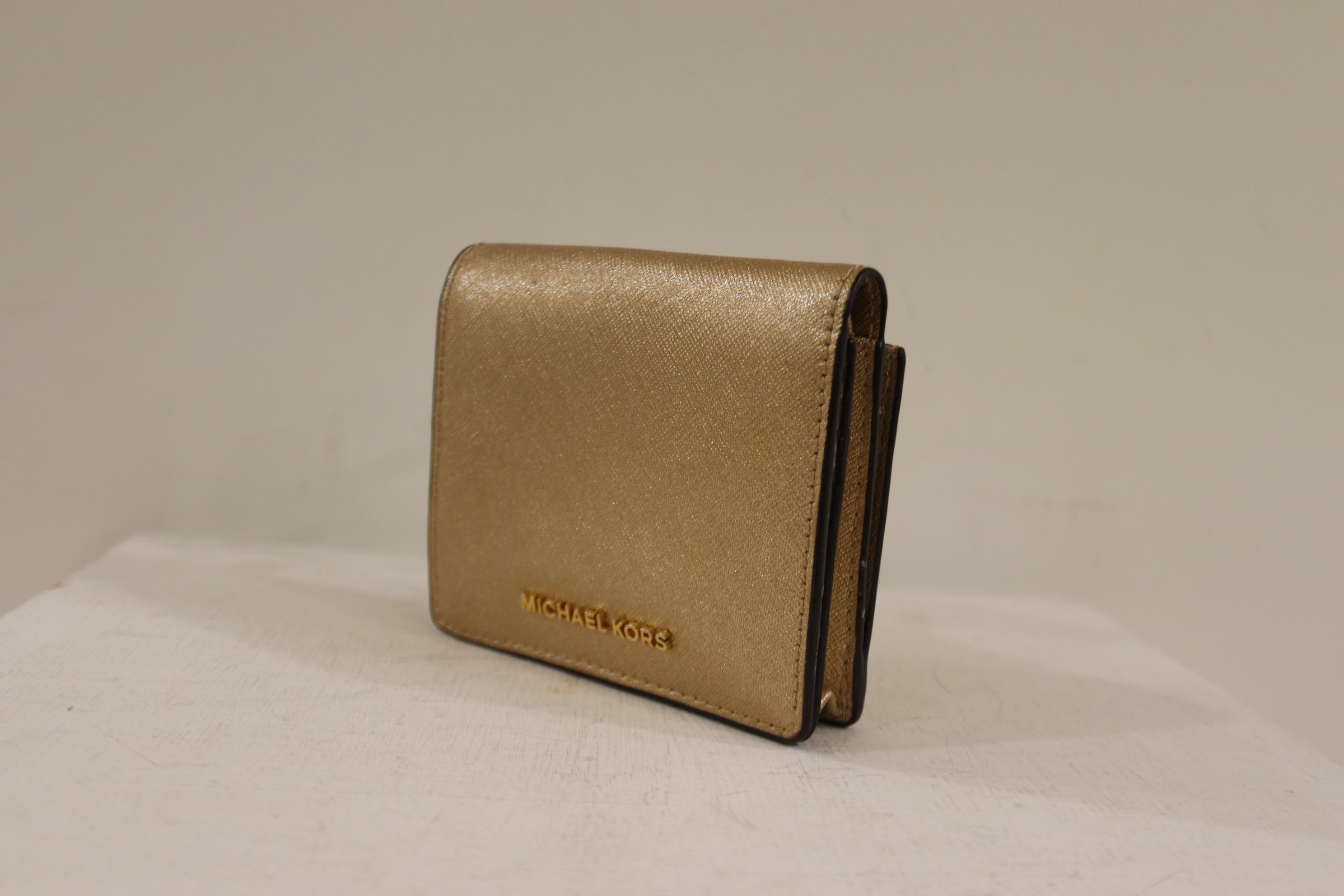 Brown Micheal Kors gold leather wallet