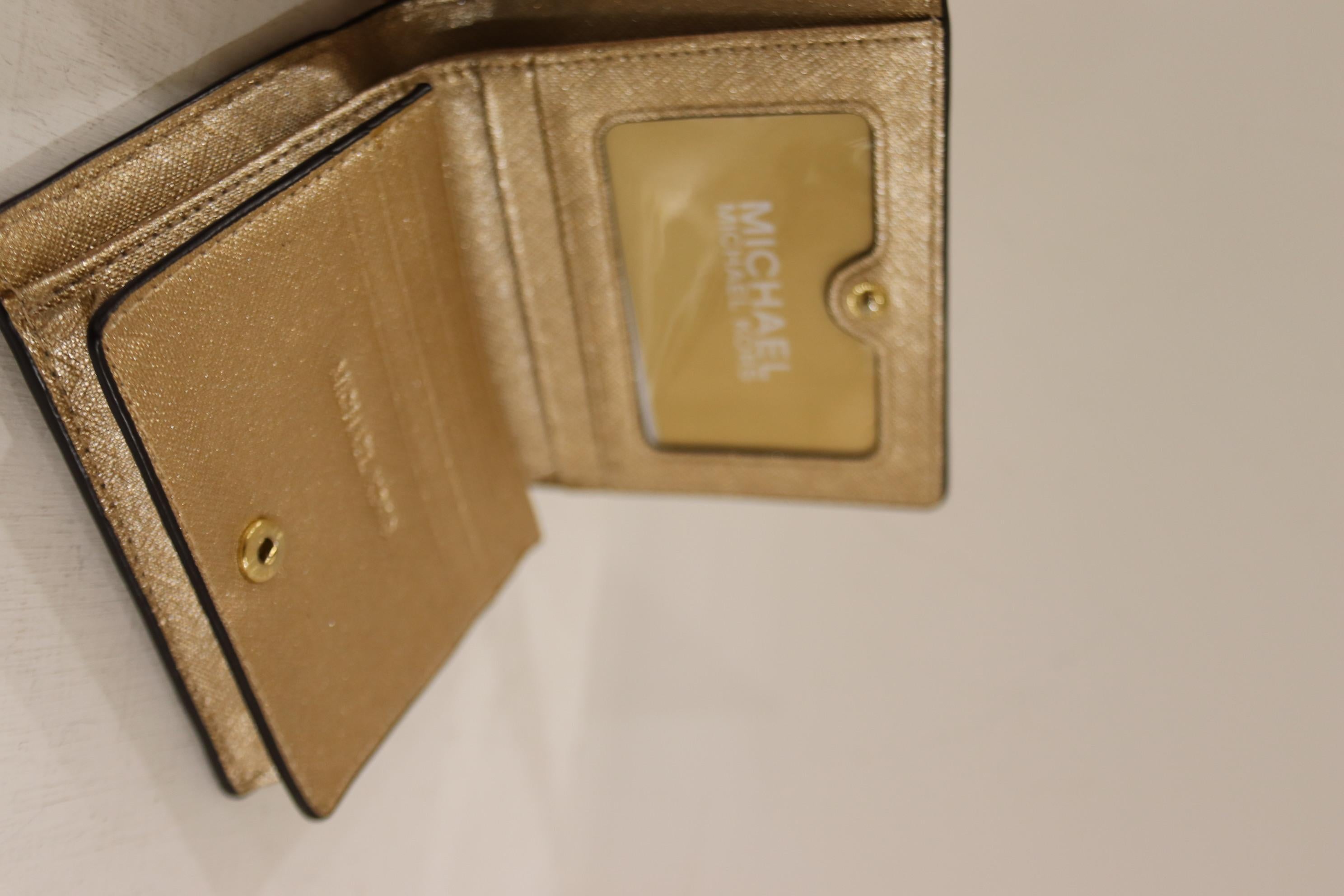 Micheal Kors gold leather wallet 1