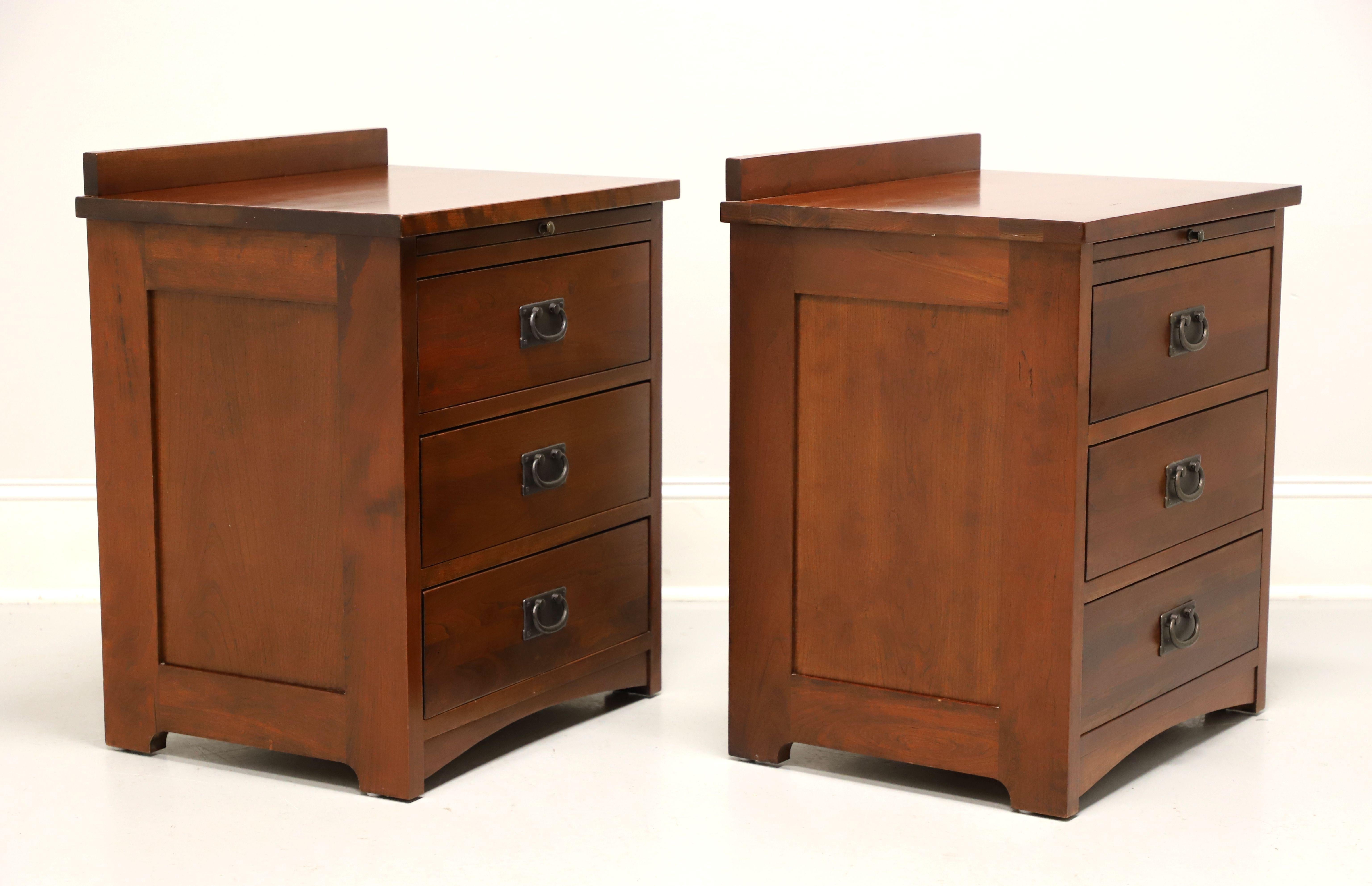 A pair of Mission / Arts & Crafts style nightstands by Miller Bedrooms, fine Amish made furniture, from their Micheal's Mission Collection. Solid cherry with cedar drawer interiors, brass hardware, square edge top with a back gallery, pull out