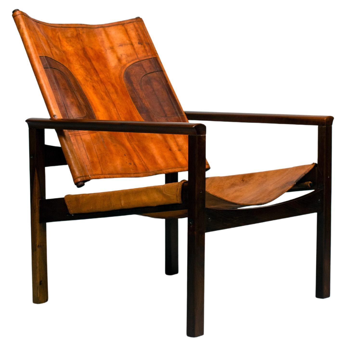 Michel Arnoult, "Peg-Lev" armchair, Solid noble wood and leather. c. 1960.