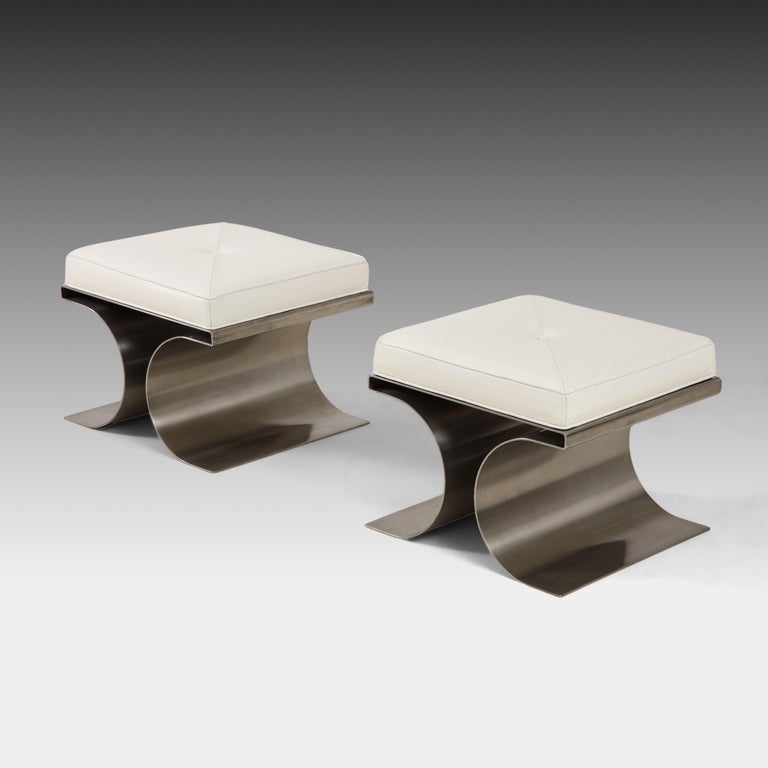 Michel Boyer rare pair of architectural 'X' stools or tabourets with stainless steel bases and white leather cushions with central button. These iconic stylish stools were produced by Editions Rouve, France, circa 1968.

Michel Boyer was an