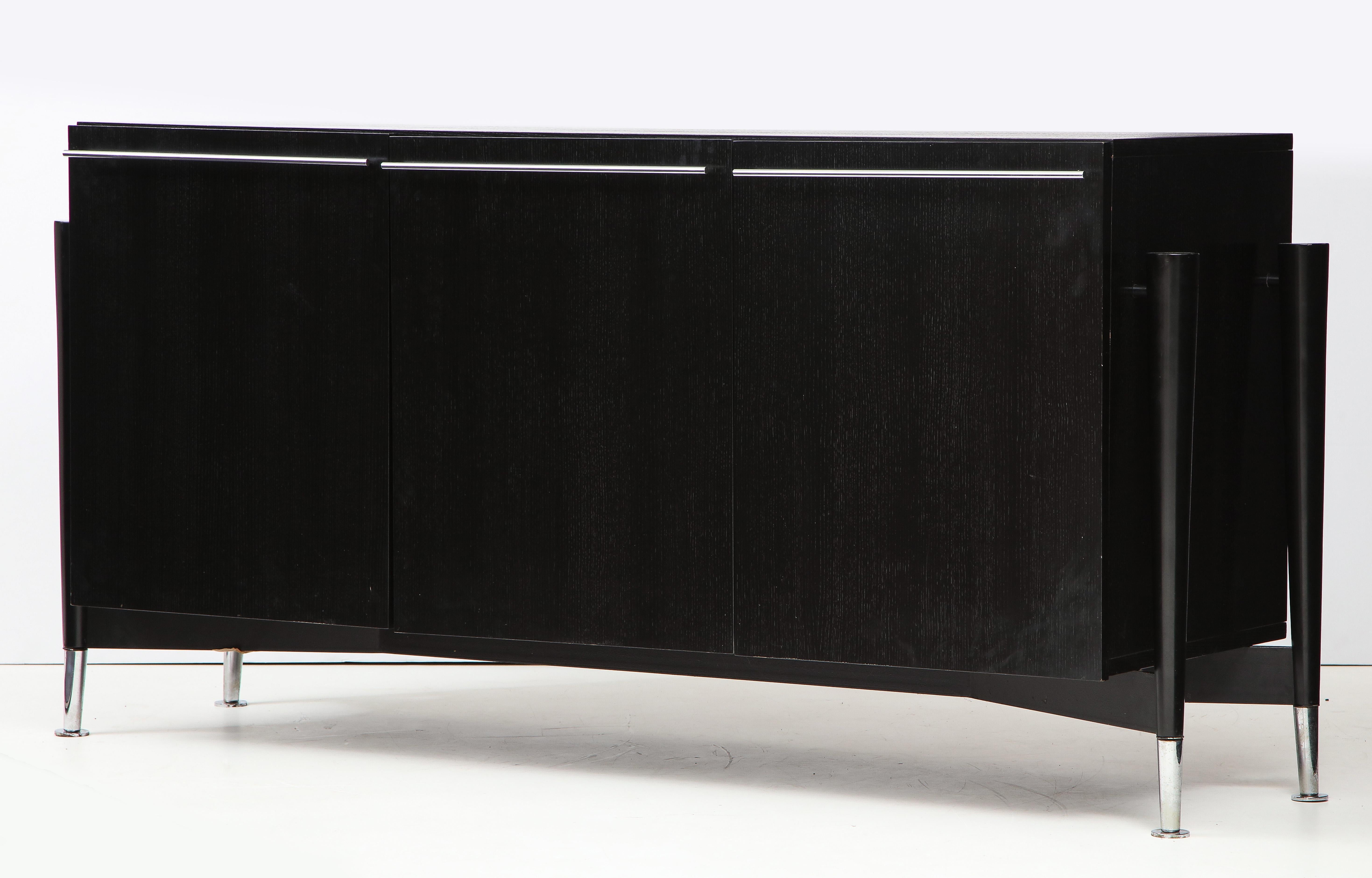 Michel Boyer (1935-2011)

Sideboard, Private commission, France, 1990, signed ‘mb’

Ash, Beech, Chromed Brass Feet & Pulls
H: 35.5 D: D: 21.5 W: 74.75 in

There are three drawers under the top, three compartments and shelves.

This items