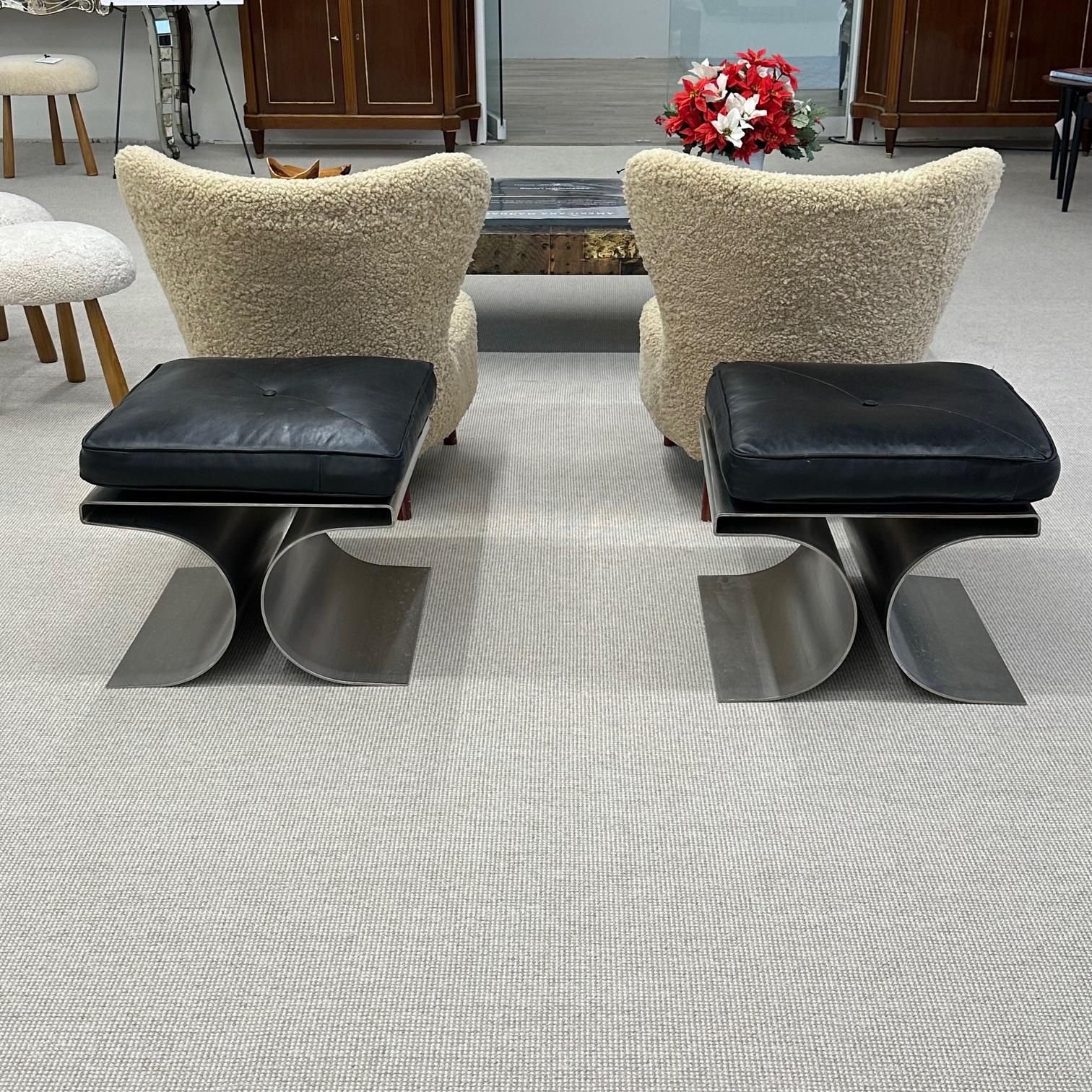 Pair of Michel Boyer Style Rouve Edition 'X' stools in a brushed stainless steel with a black leather cushion. These impressive Mid-Century Modern benches are simply stunning. The strong heavy and sturdy bases having the 'X' form with a flat top