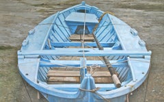 "Waiting on the Tide" a photorealist oil painting, overlooking a blue boat