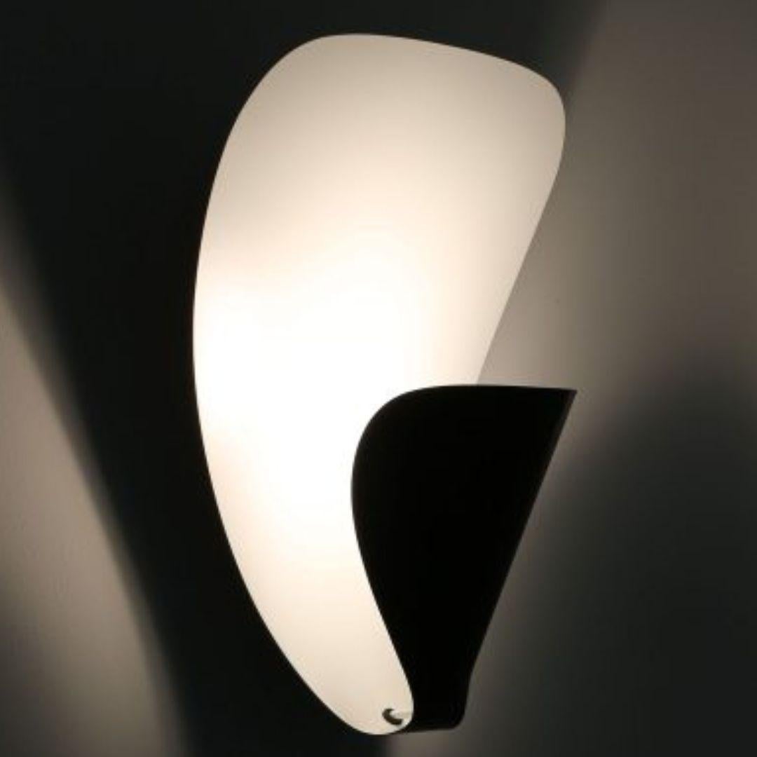 Michel Buffet 'B206' black and white wall lamp for Disderot. 

Originally designed in 1953, this authorized re-edition is still produced in France to the exacting standards of Disderot with many of the same small-scale manufacturing techniques and