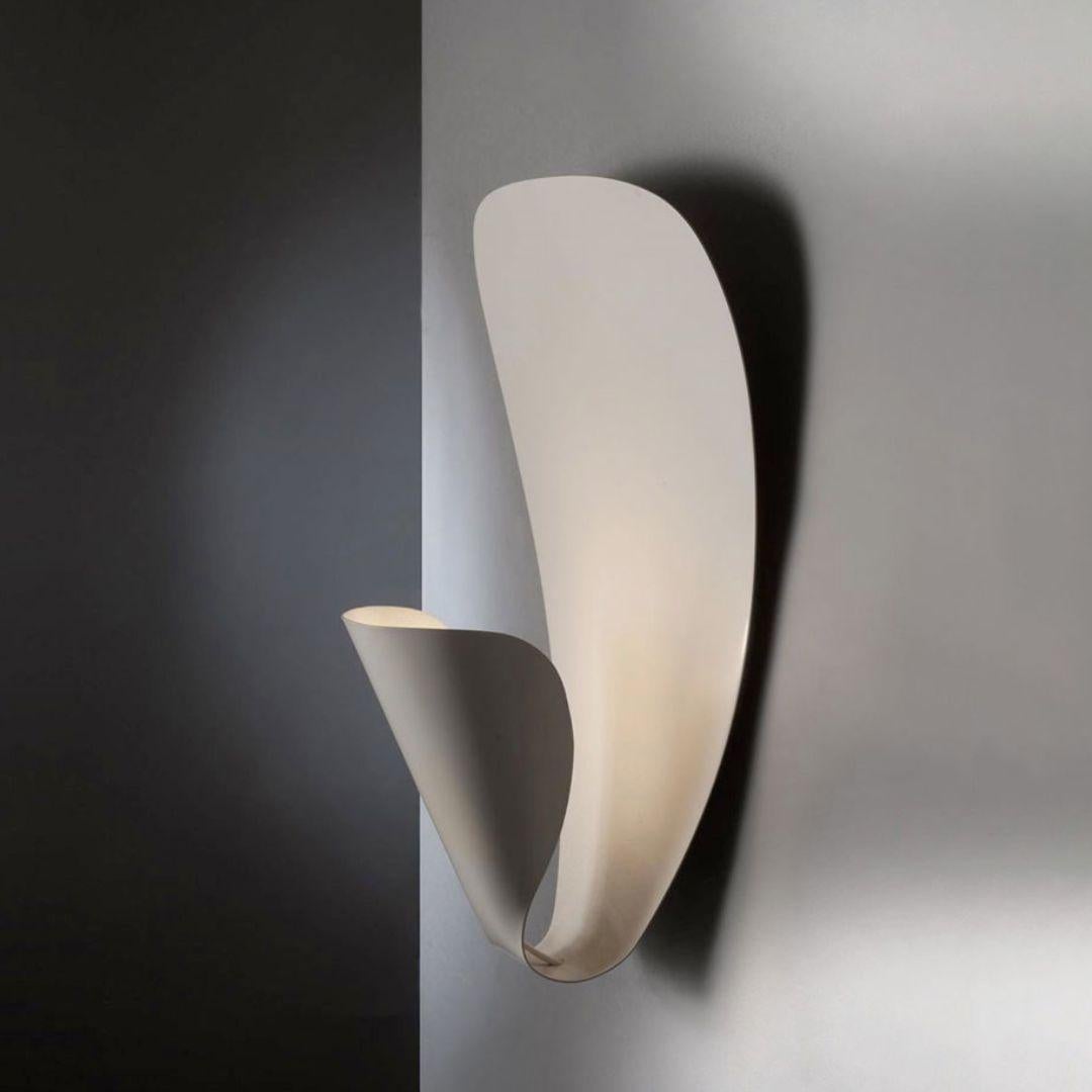 Michel Buffet 'B206' white wall lamp for Disderot. 

Originally designed in 1953, this authorized re-edition is still produced in France to the exacting standards of Disderot with many of the same small-scale manufacturing techniques and
