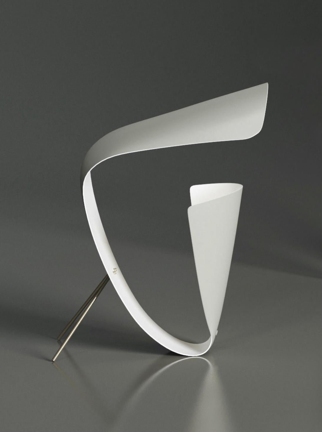 Michel Buffet Mid-Century Modern White B201 desk lamp designed in 1953.

The production of this re-edition lamps, wall lights and floor lamps are manufactured using craftsman’s techniques with the same materials and techniques as the first models.