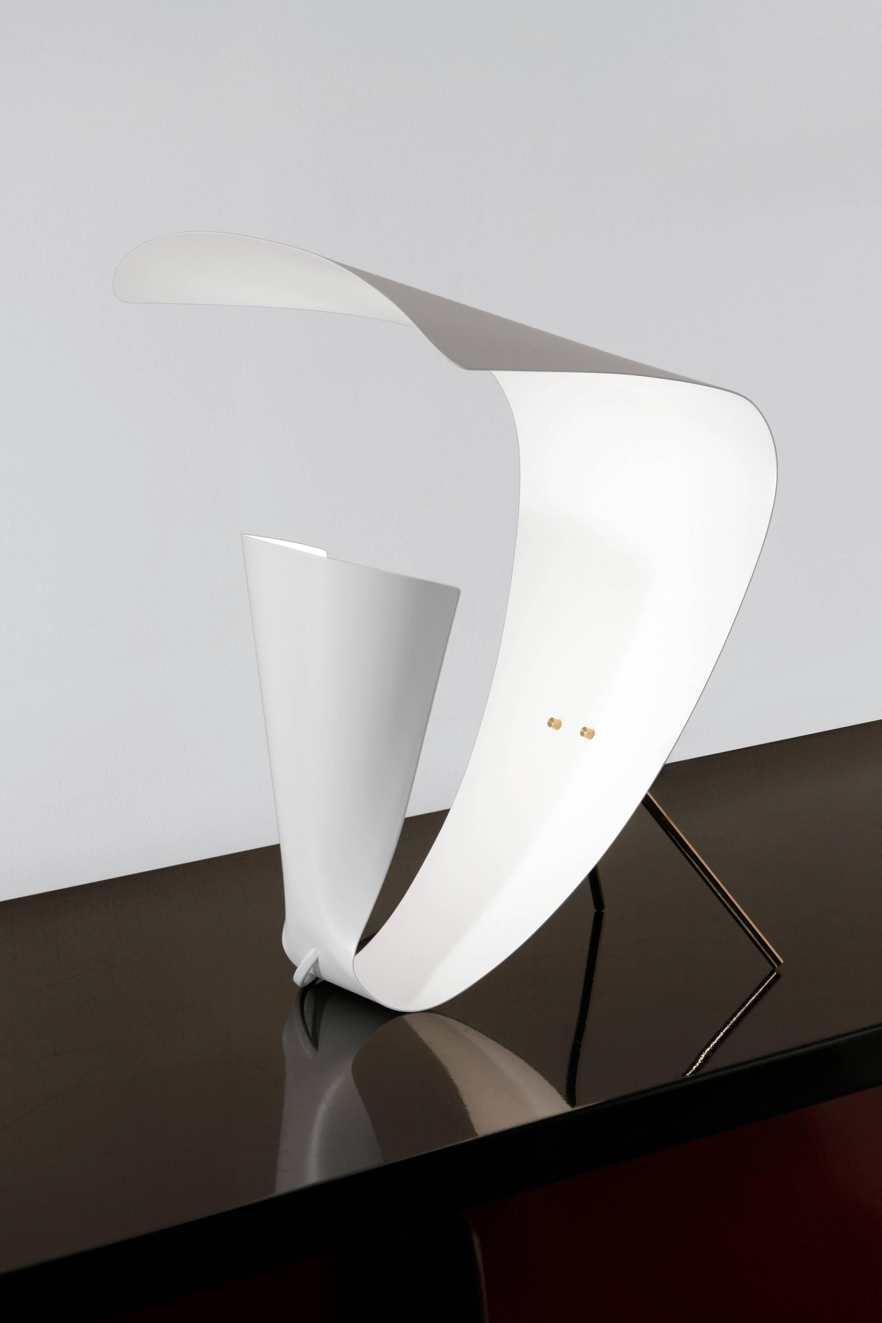 Michel Buffet Mid-Century Modern white B201 desk lamp designed in 1953.

The production of this re-edition lamps, wall lights and floor lamps are manufactured using craftsman’s techniques with the same materials and techniques as the first models.