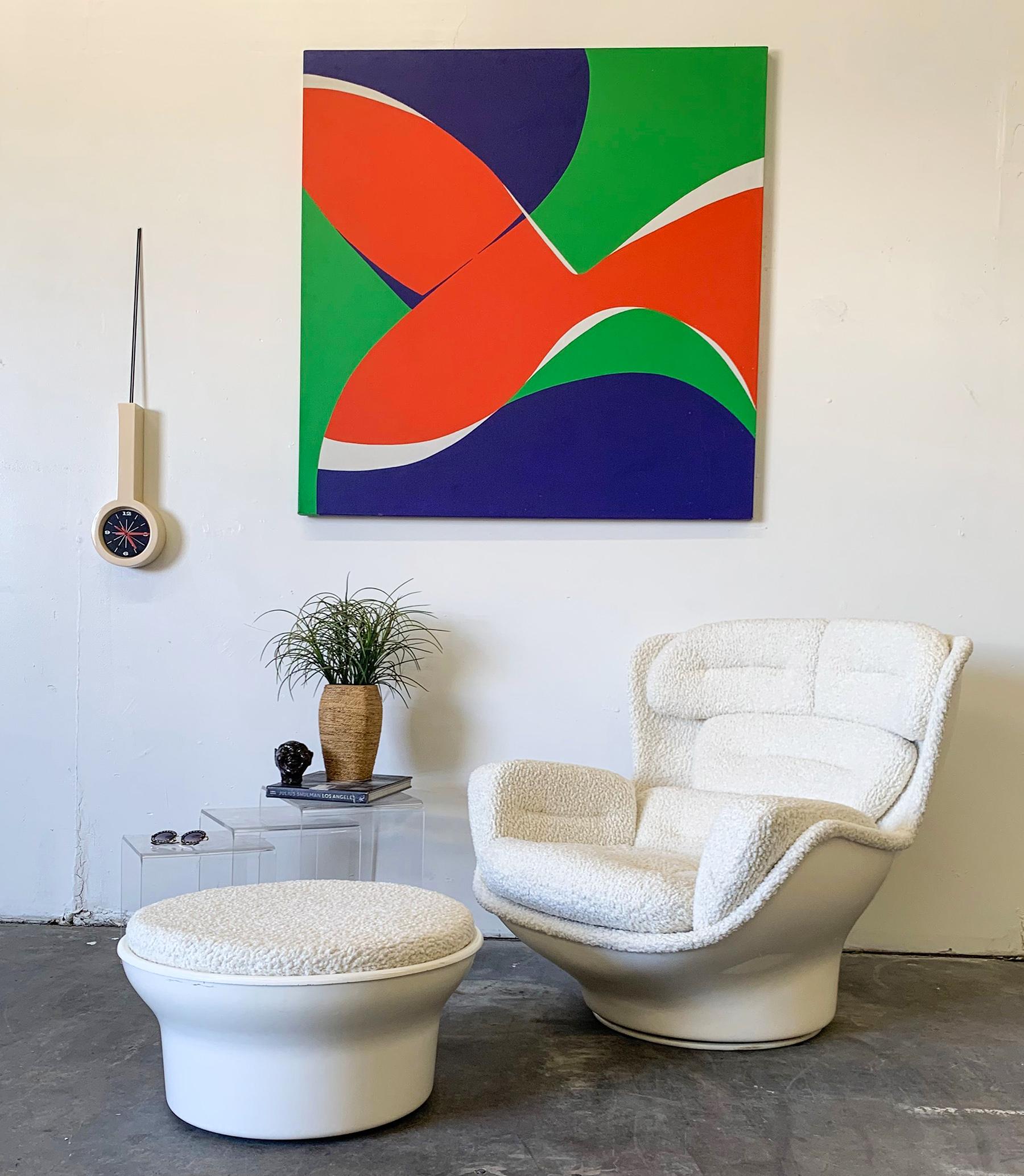 This gorgeous chair is the brainchild of our gallery. After picking up a 1970s Space Age fiberglass chair designed by Michel Cadestin Karate chair, we couldn't help but notice how sloppy the vintage vinyl button tufted upholstery was. We then