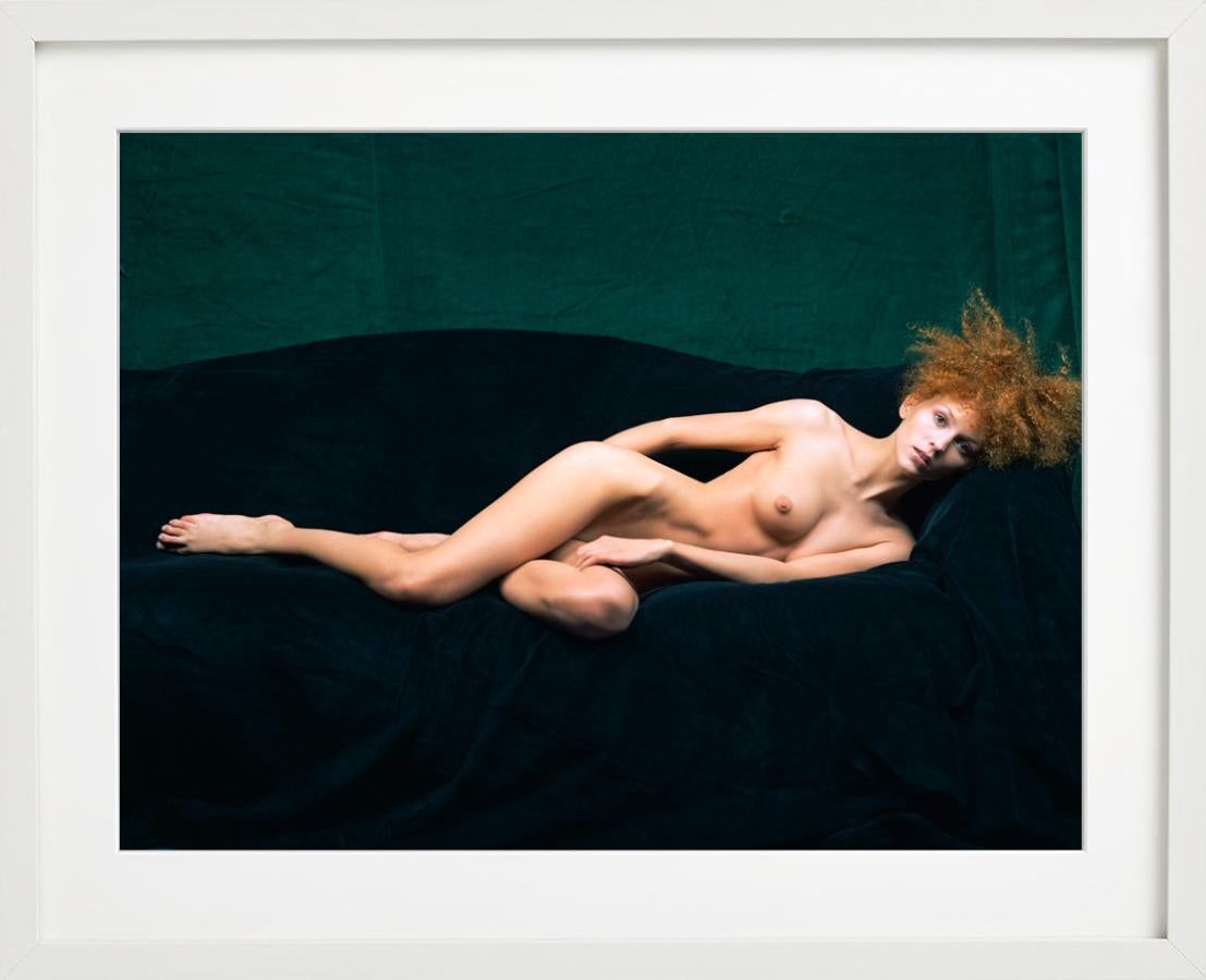 Anonymous Nude V - model lounging on green sofa, fine art photography, 1998 - Photograph by Michel Comte