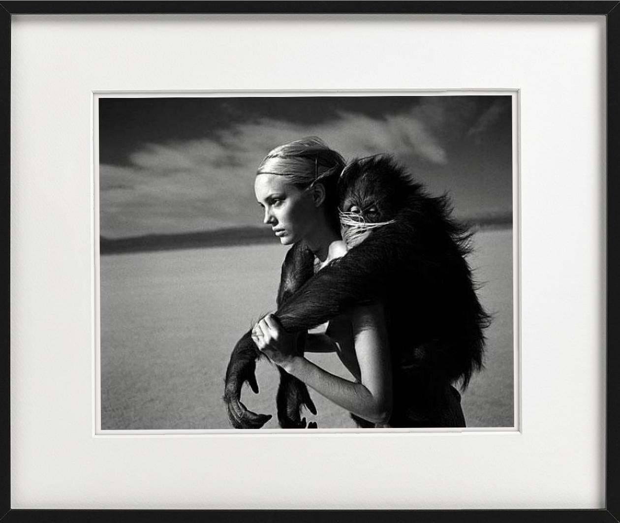 Beauty and Beast I - nude in the desert with monkey, fine art photography, 1996 - Gray Black and White Photograph by Michel Comte