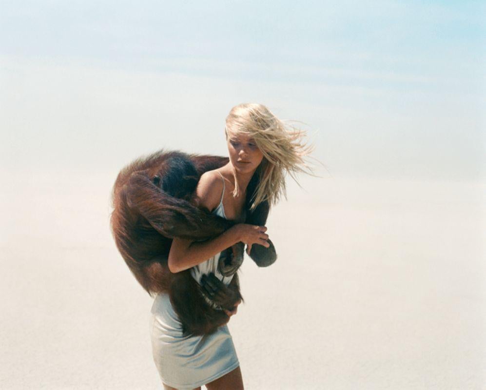 Michel Comte Nude Photograph - Beauty and the Beast - model in the dessert with monkey around her