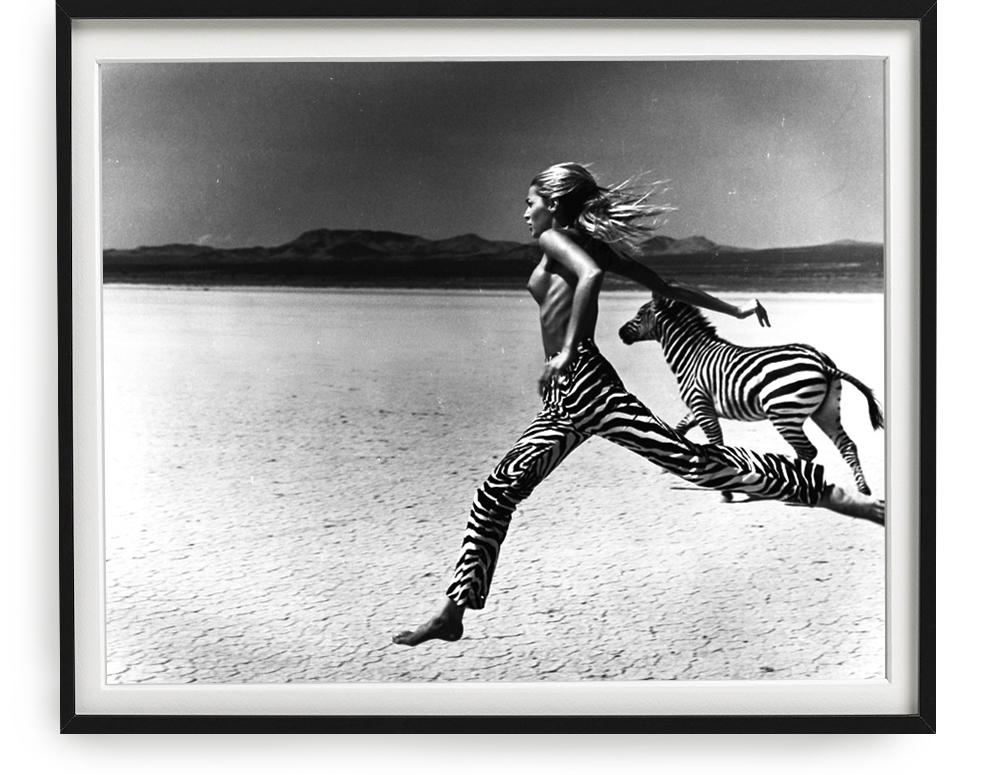 Michel Comte Nude Photograph - Beauty and the Beast - nude model running through the desert with a zebra b&w