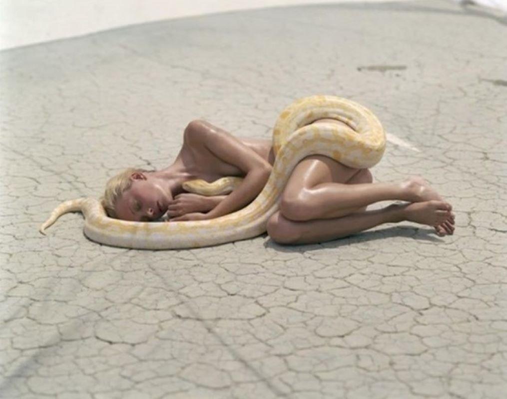 Michel Comte Color Photograph - Beauty and the beast with snake - the supermodel in the desert with the animal 