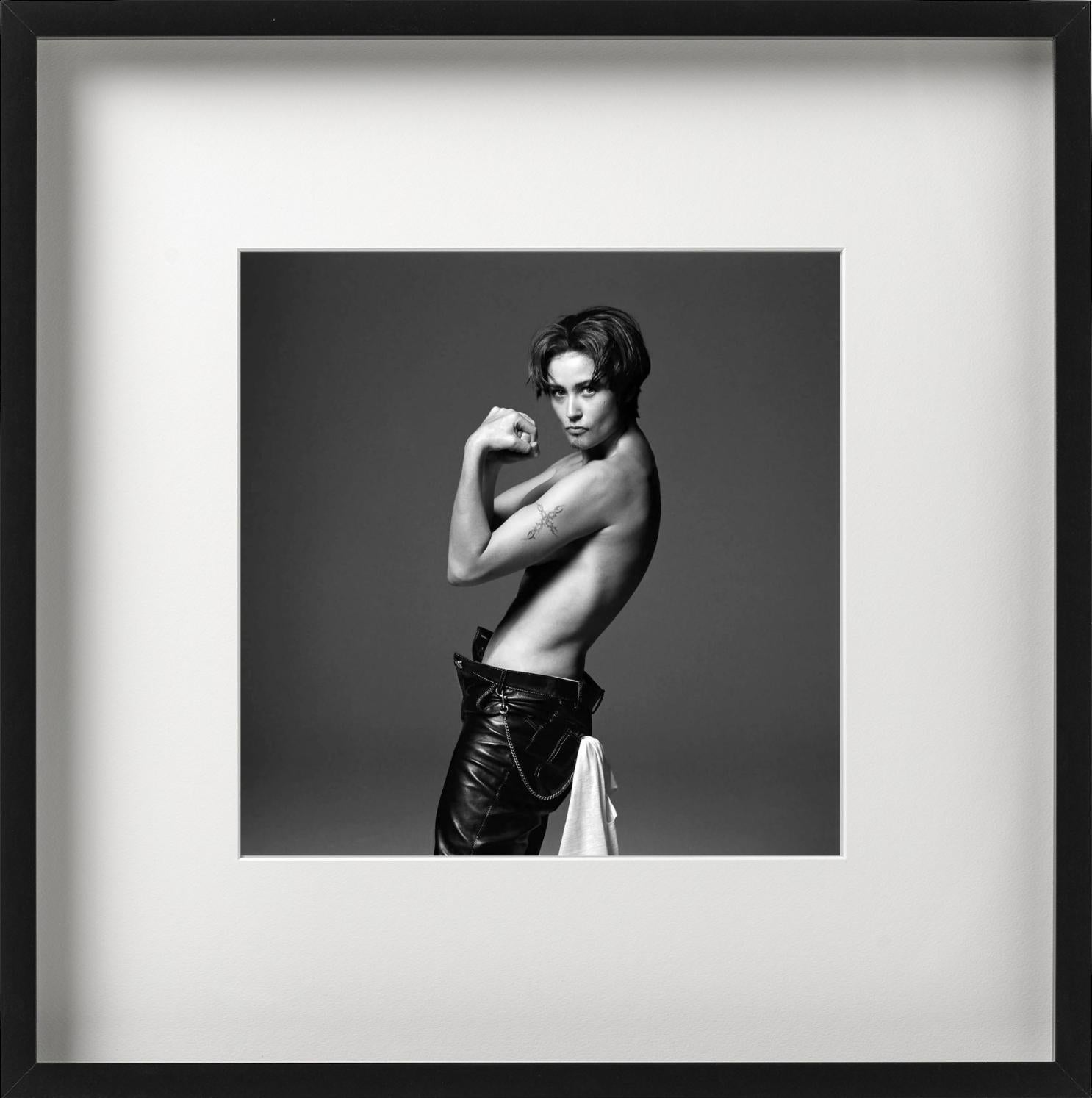 Demi Moore - model posing topless in leather pants, black-and-white photograph - Photograph by Michel Comte