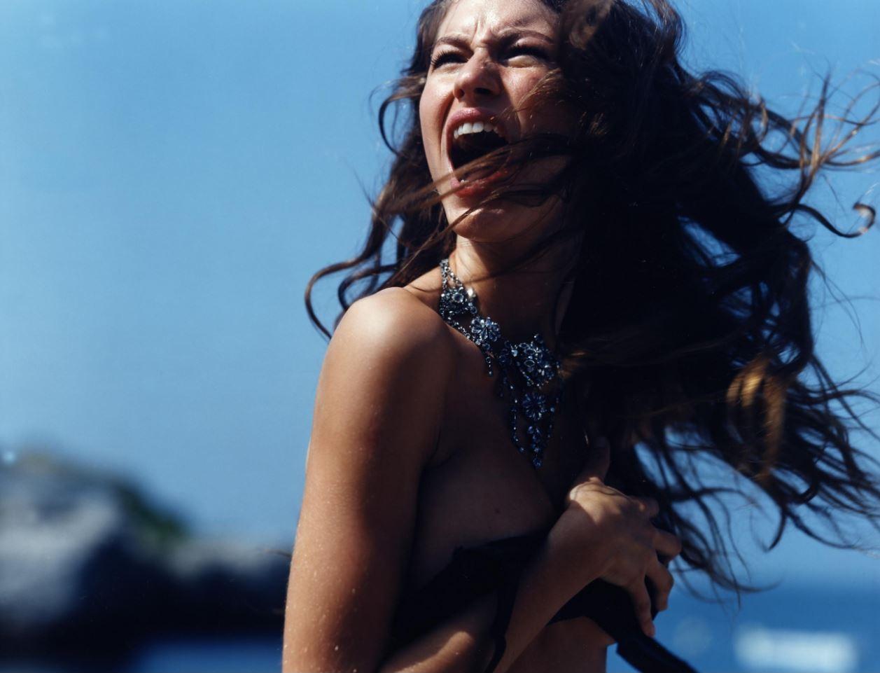 Michel Comte Color Photograph - Gisele Buendchen Screaming, Cannes - the naked supermodel standing against sky