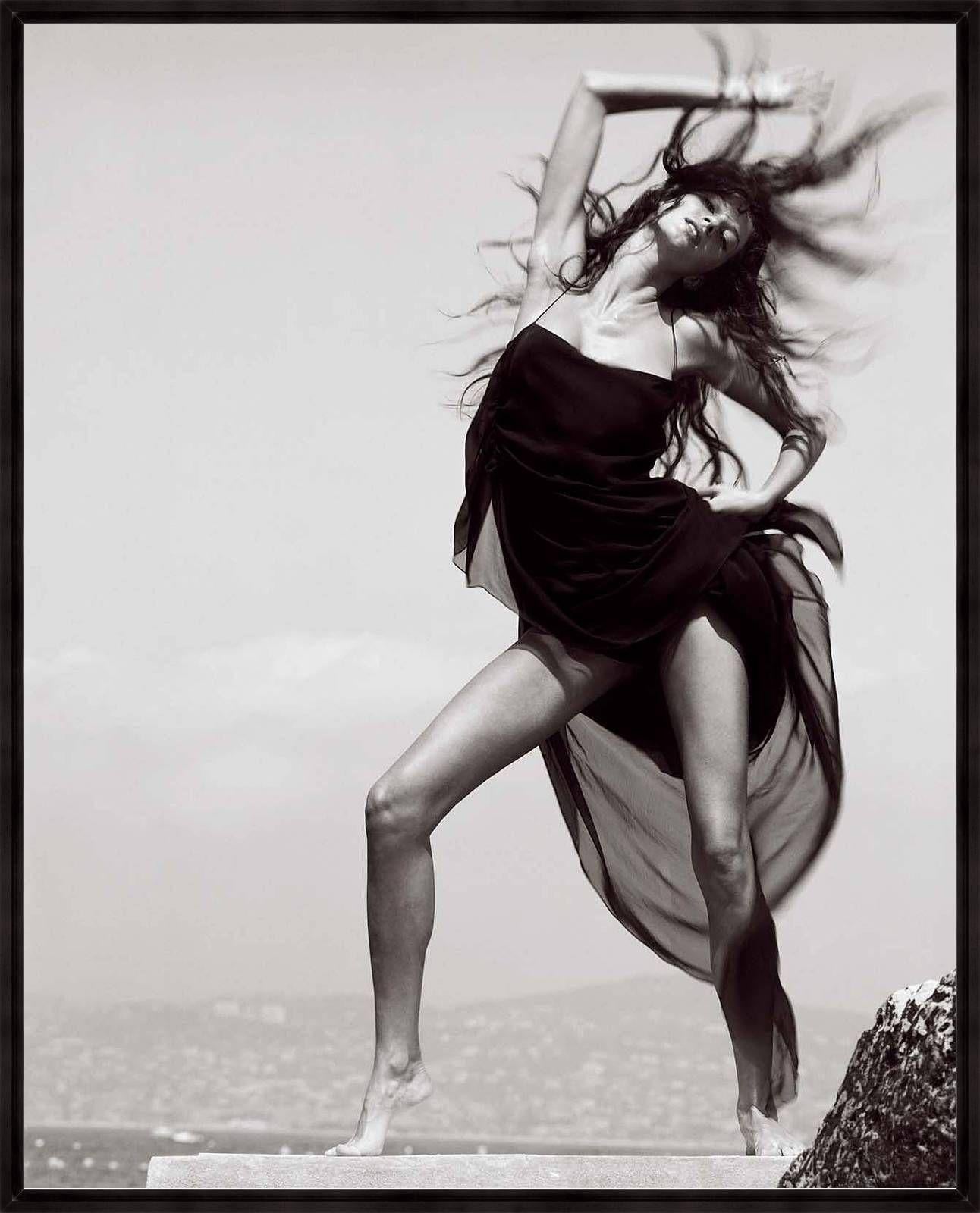 Michel Comte Portrait Photograph - Gisele Buendchen - the naked supermodel in a black dress, wind blowing in Cannes