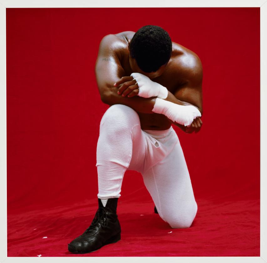 Mike Tyson - Portrait of the boxing legend on his knees - Red Color Photograph by Michel Comte