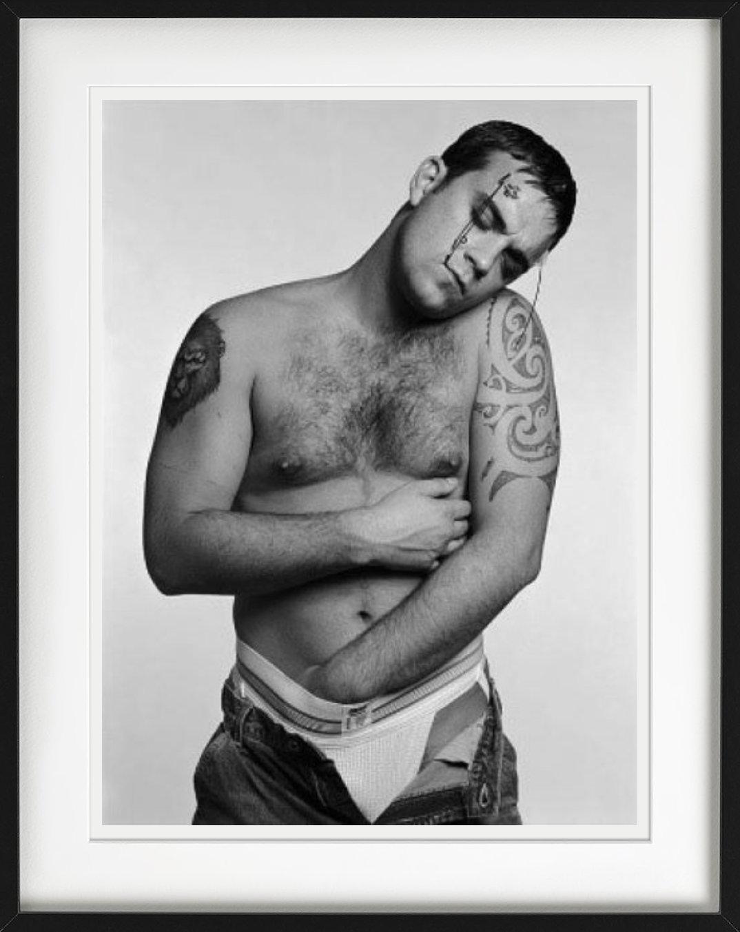 Robbie Williams photographed by Michel Comte.

All prints are limited edition. Available in multiple sizes. High-end framing on request.

All prints are done and signed by the artist. The collector receives an additional certificate of authenticity