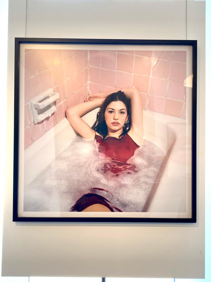 Sofia Coppola - the regisseur and actress lying in a bath tube with dress on - Beige Color Photograph by Michel Comte