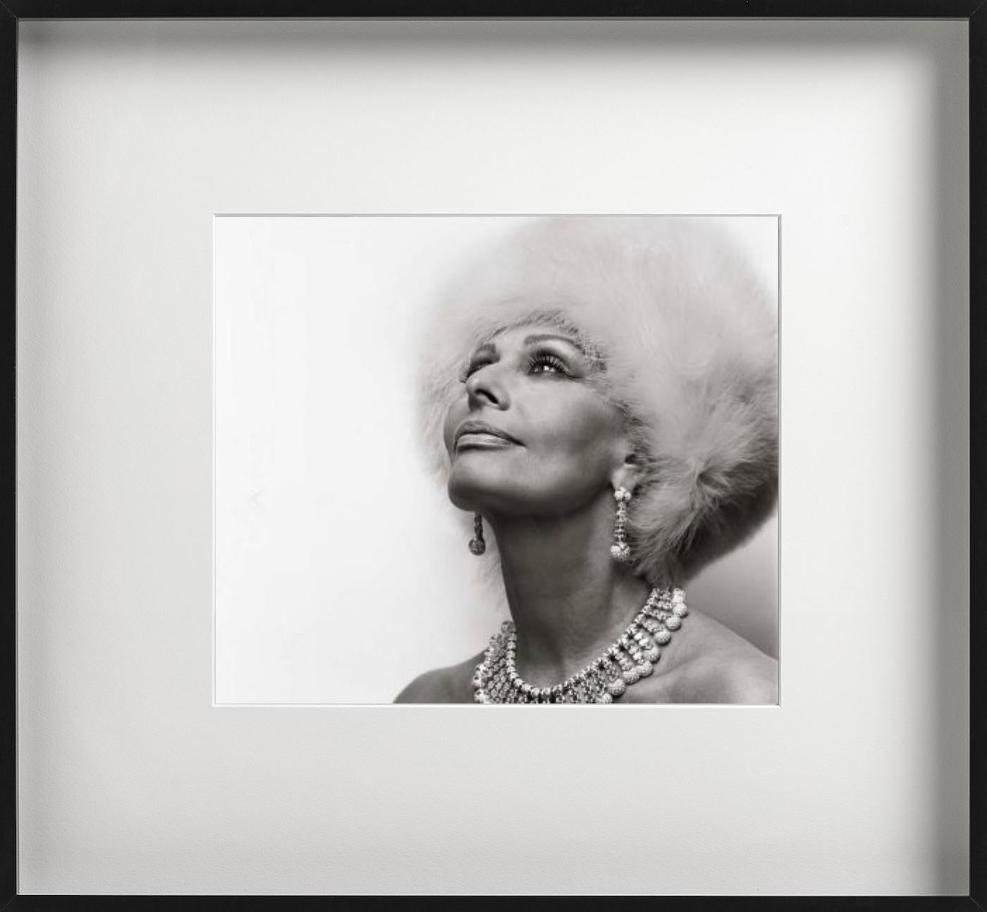 Black and white portrait of the Hollywood icon Sophia Loren in a white fur hat and jewelry, photographed by Michel Comte in 1994.

All prints are limited edition. Available in multiple sizes. High-end framing on request.

All prints are done and