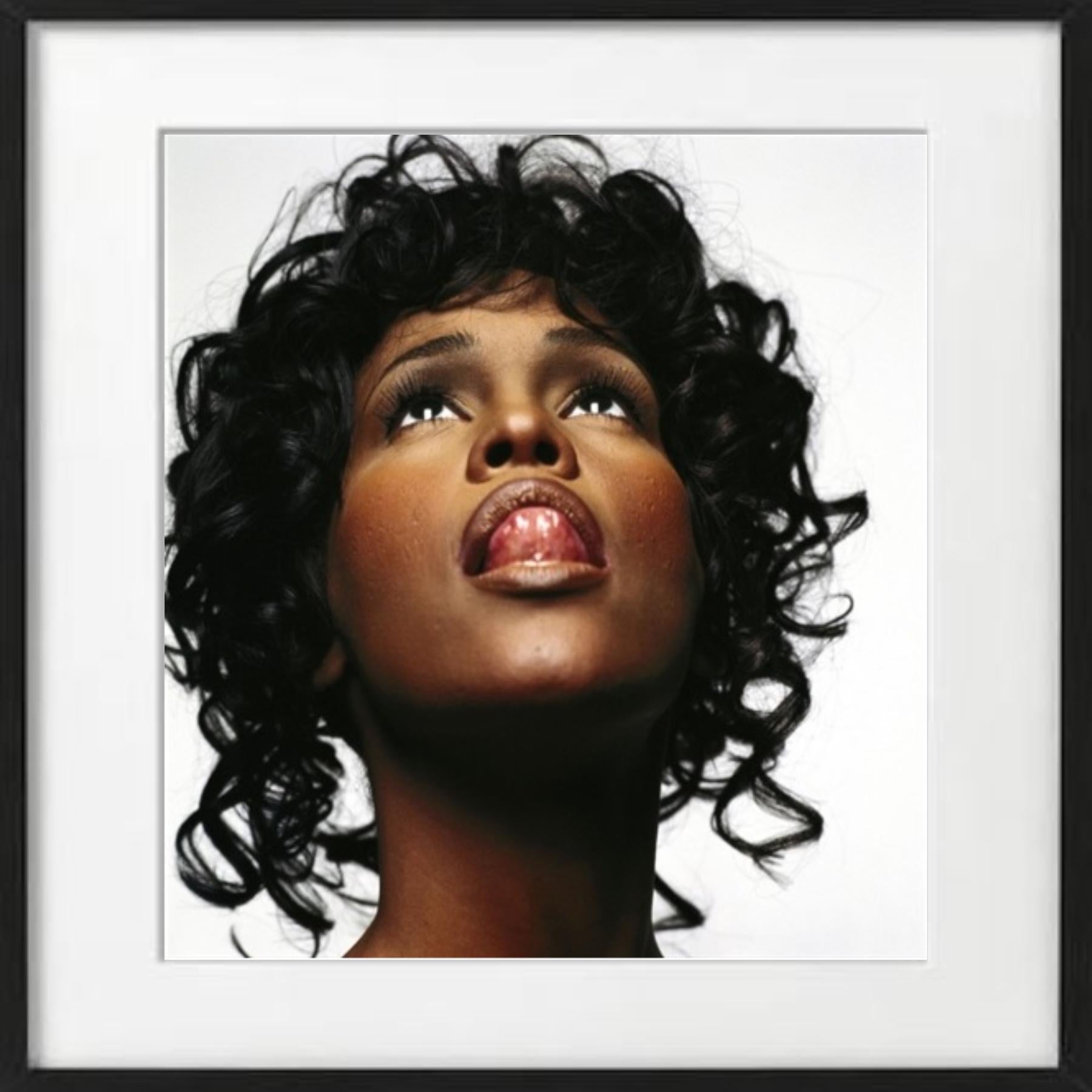 Whitney Houston - portrait of the famous actress with her tongue out - Photograph by Michel Comte