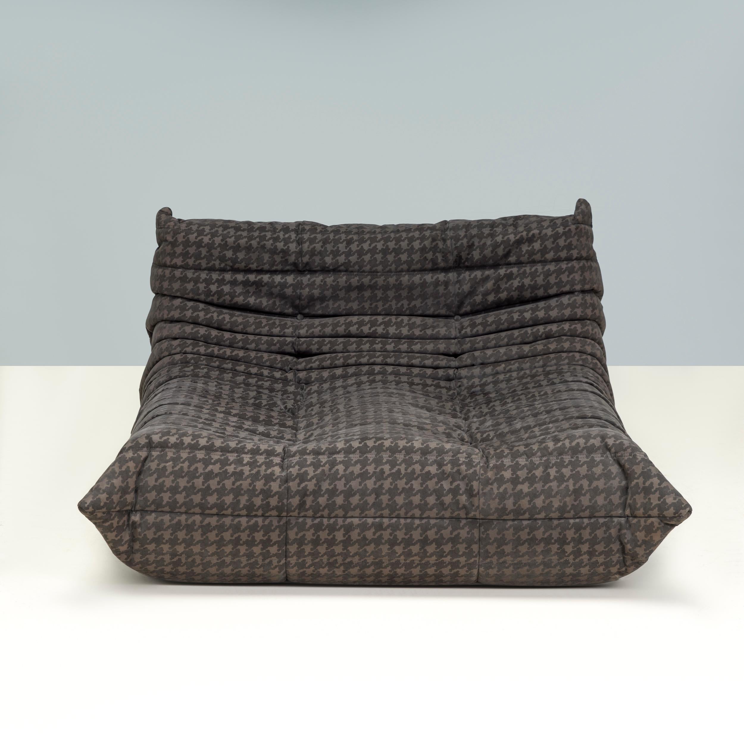 The iconic Togo sofa, originally designed by Michael Ducaroy for Ligne Roset in 1973, has become a design classic. 

This chaise longue model is upholstered in the original brown houndstooth alcantara fabric and features the instantly recognisable
